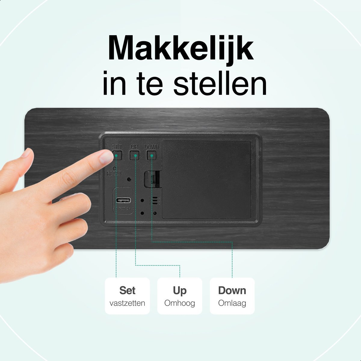 A hand touches a wooden clock's button. Text reads 'Makkeklijk in te stellen'. Buttons labeled 'Set', 'Up', 'Down' are shown.
