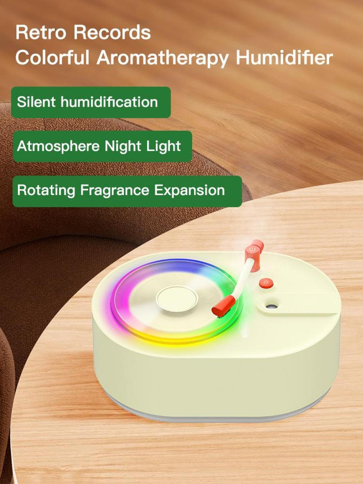 Aromatherapie-Luftbefeuchter in Form eines Retro-Plattenspielers mit bunten Lichtern und Knöpfen. Auf einem Holztisch.