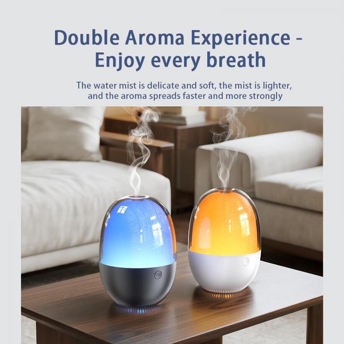 Zwei Aromadiffusoren auf einem Tisch. Einer blau, einer orange, beide geben Dampf ab. Text lautet 'Double Aroma Experience'.