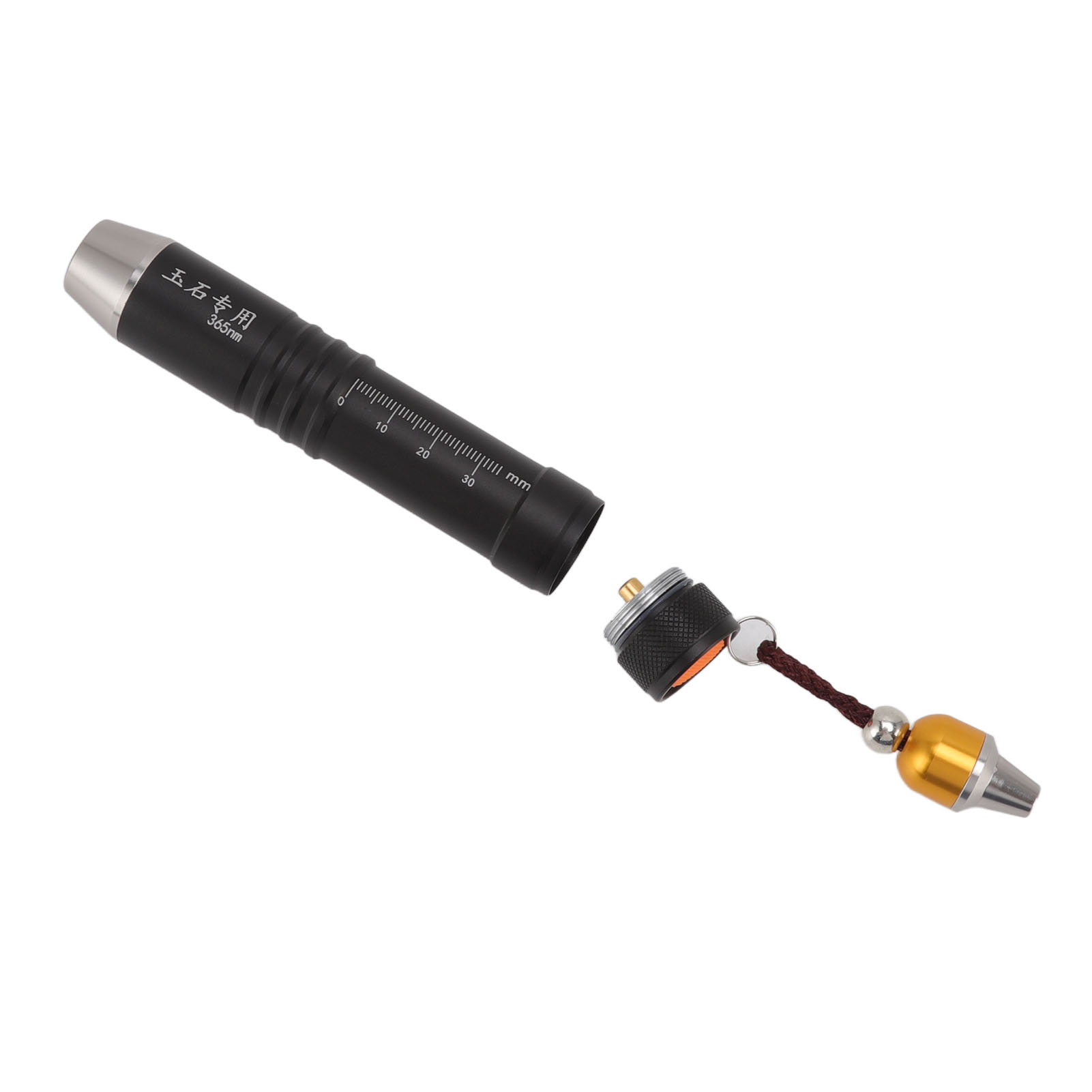 Schwarze und silberne Taschenlampe. Zerlegt, mit schwarzer Kappe und einem Gold-Silber-Anhänger daran.