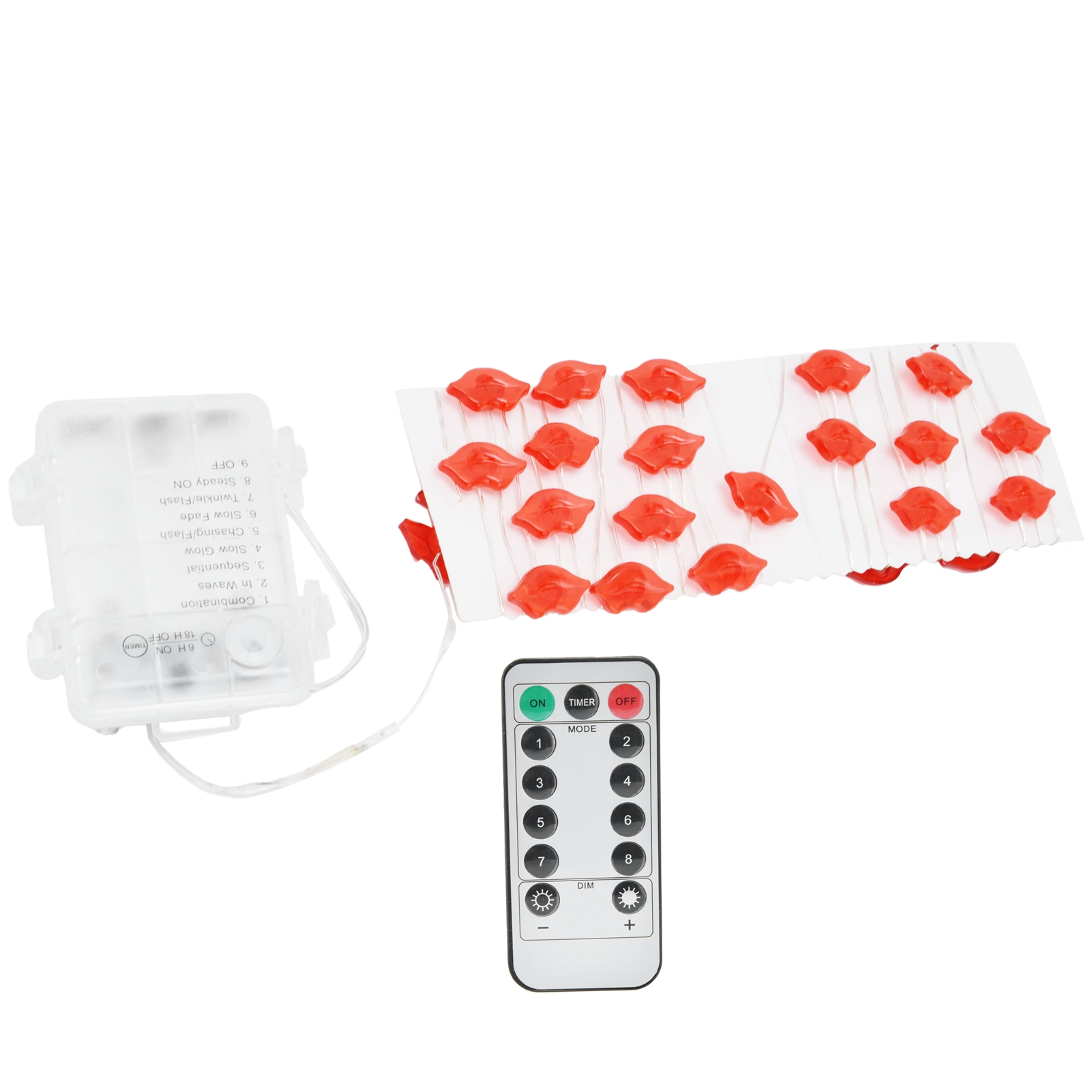 Anordnung roter, lippenförmiger Lichter, Batteriebox und Fernbedienung auf weißer Oberfläche.