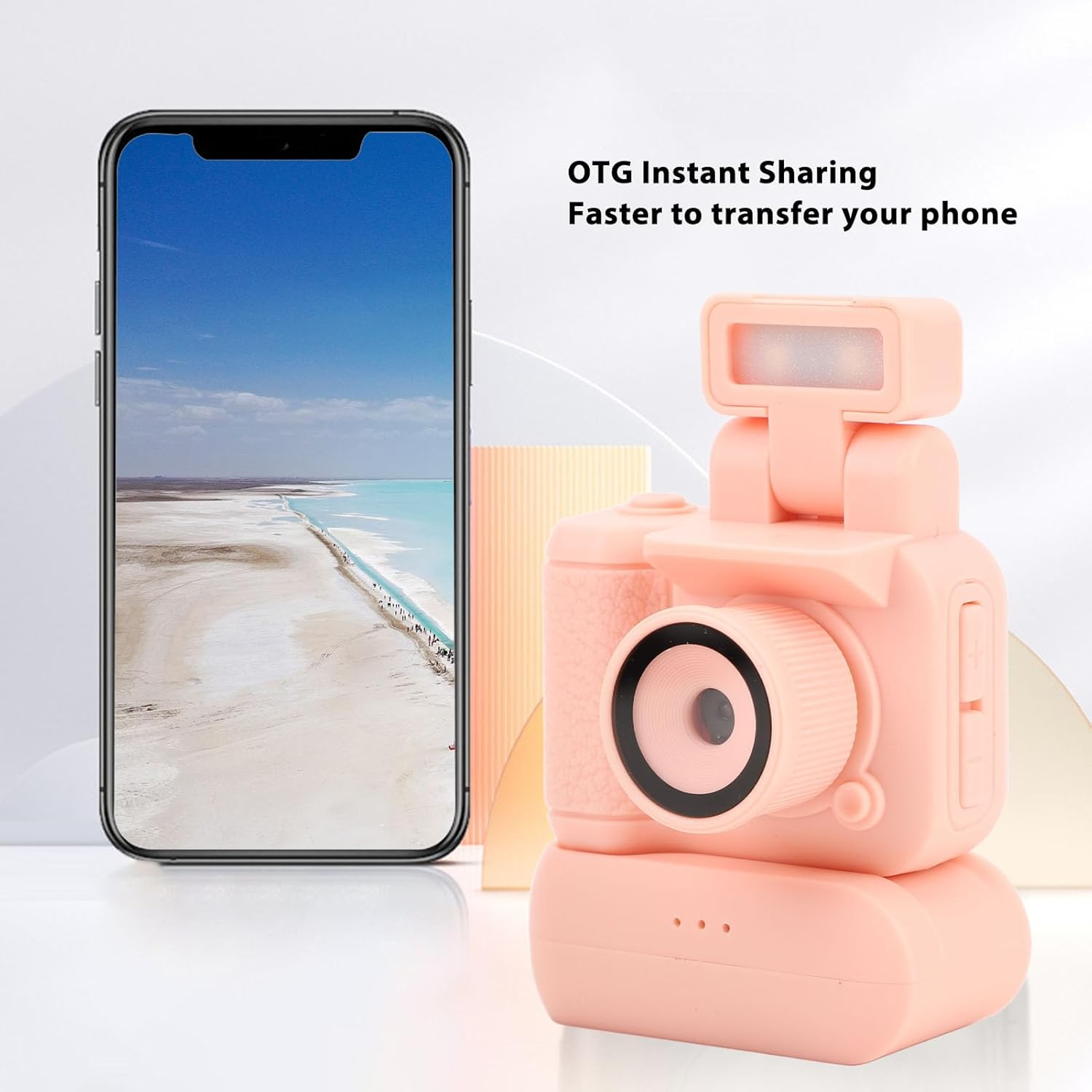 Ein rosa kameraähnliches Gerät mit einem Telefon, das eine Landschaft zeigt. Der Text lautet "OTG Instant Sharing" und "Schneller, um Ihr Telefon zu übertragen".