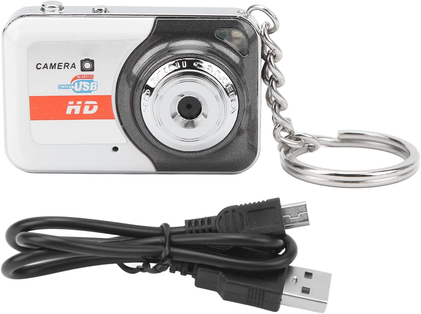 Eine Minikamera mit Schlüsselanhänger und USB-Kabel. Die Kamera ist weiß und grau. Das Kabel ist schwarz.