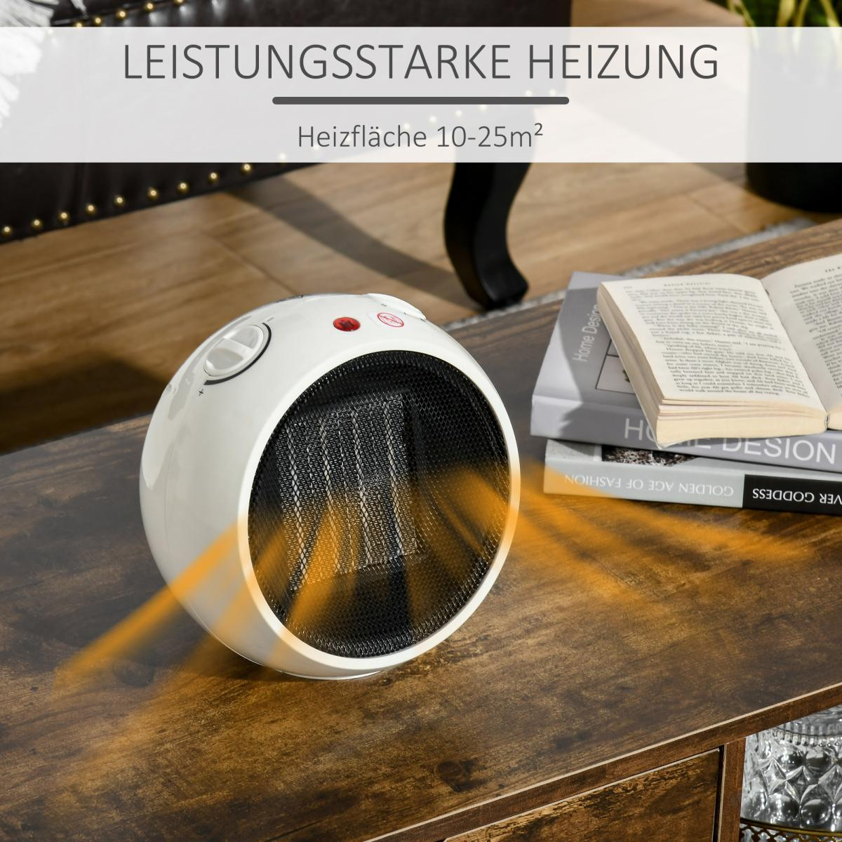 Ein weißer, runder Heizlüfter auf einem Holztisch. Bücher sind im Hintergrund. Oranges Licht geht vom Heizlüfter aus.
