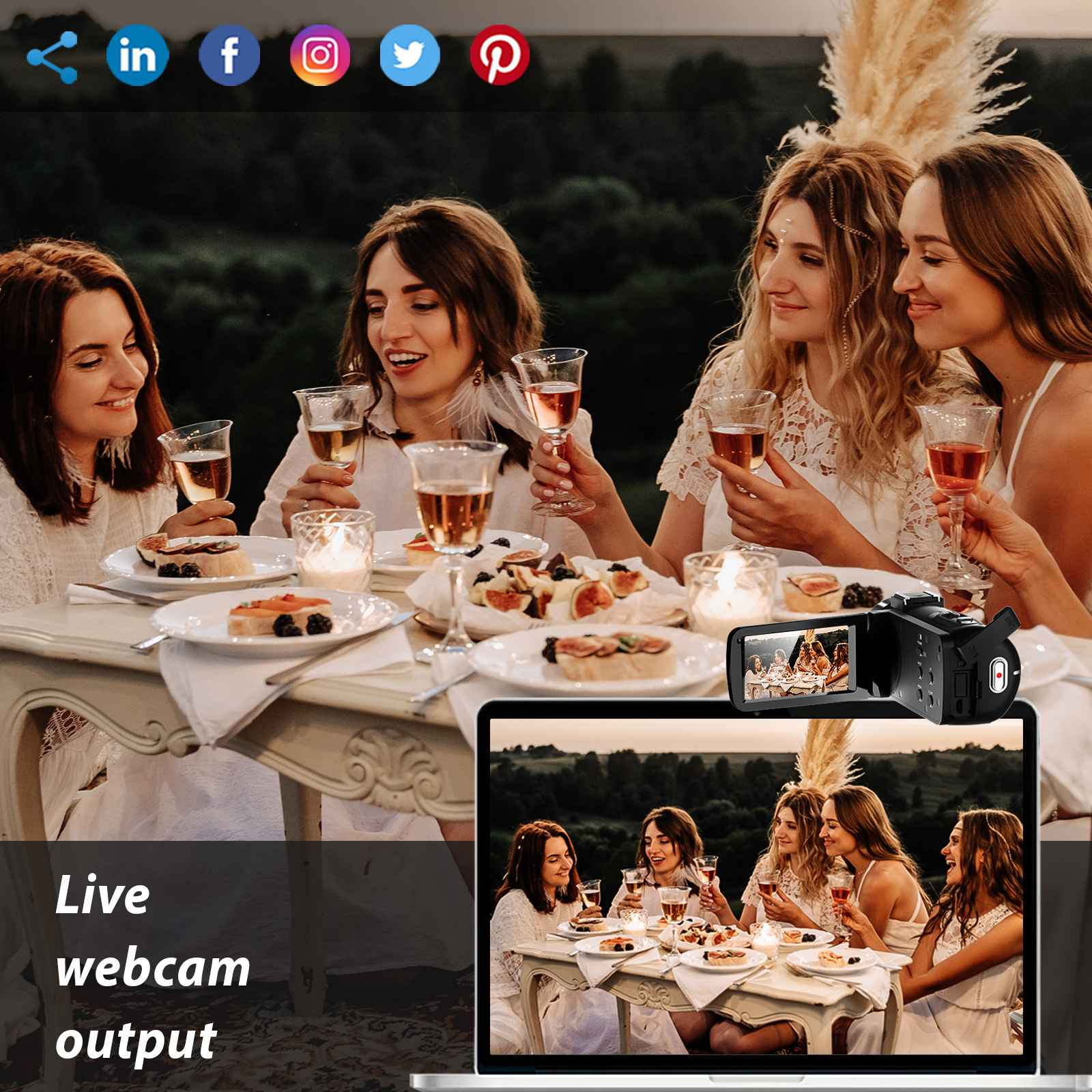 Vier Frauen an einem Tisch mit Essen und Getränken. Ein Laptop zeigt dieselbe Szene. Eine Camcorder ist vorhanden.