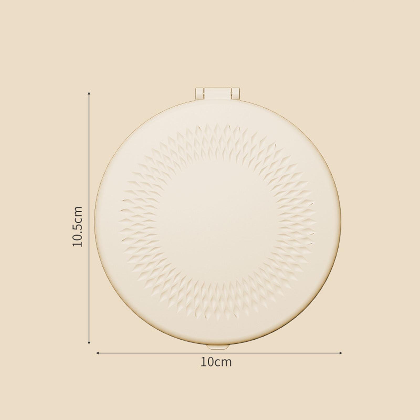 Ein beiges, rundes Kompakt-Make-up mit strukturiertem Design und beschrifteten Abmessungen. Es ist 10 cm breit und 10,5 cm hoch.