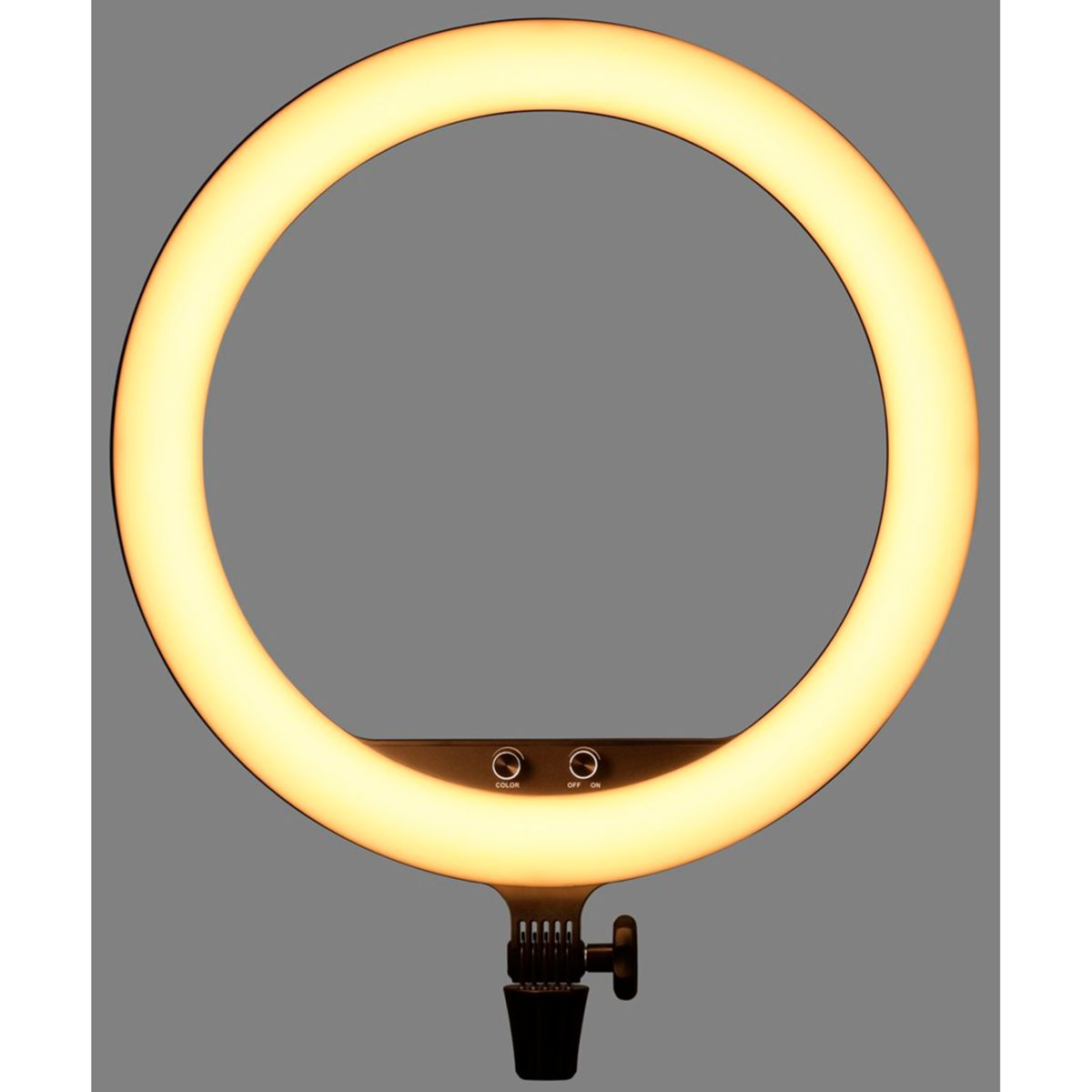 Ein gelb leuchtendes Ringlicht dominiert das Bild. Bedienelemente sind unten sichtbar. Es ist auf einem schwarzen Ständer vor grauem Hintergrund montiert.