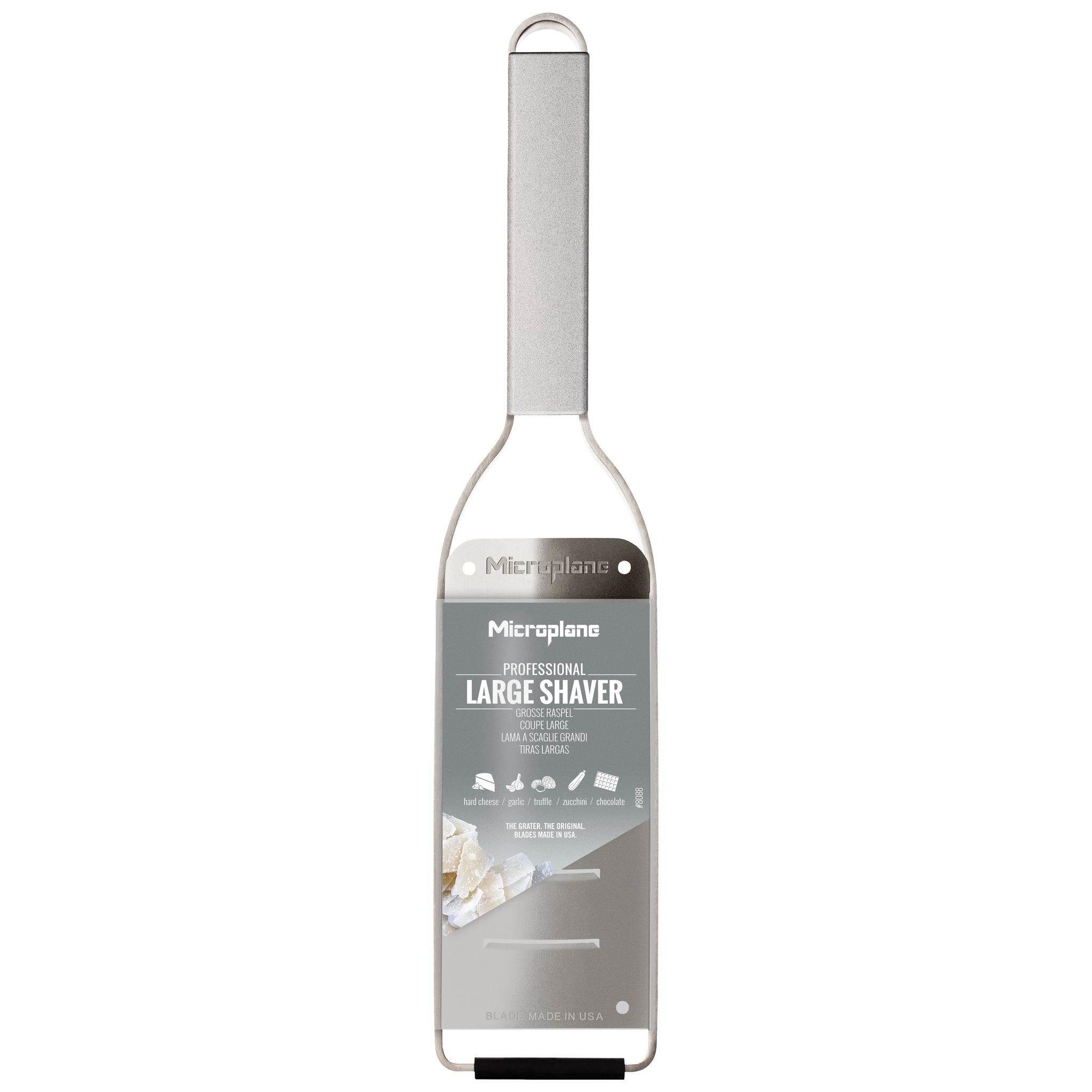 Ein Microplane Professional Large Shaver. Es ist silberfarben und hat einen Griff. Text erwähnt Käse, Knoblauch, Trüffel, Zucchini und Schokolade.