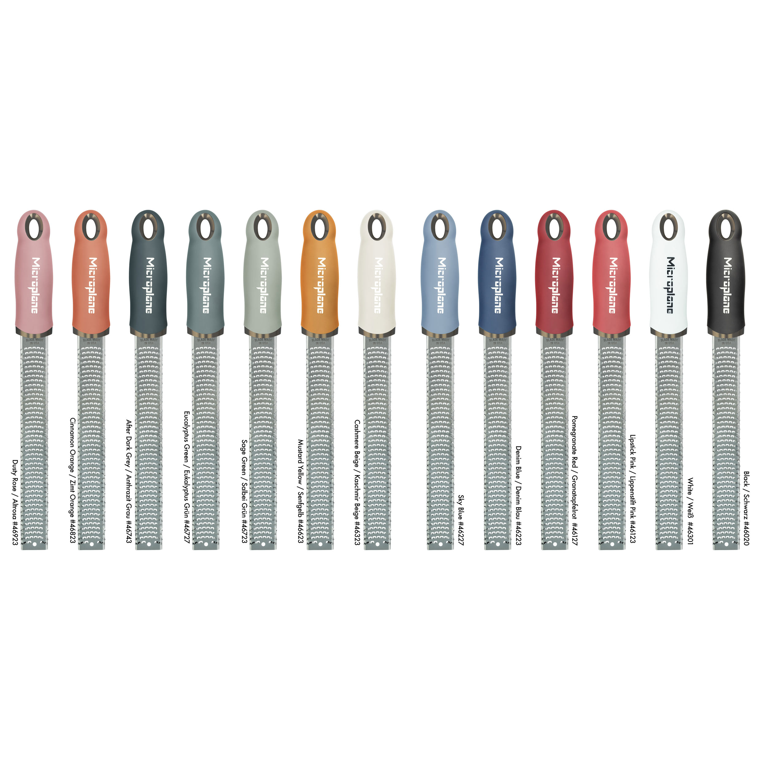 Eine Sammlung bunter Microplane-Reiben. Jede Reibe hat eine andere Griffarbe und eine Metallreibefläche.