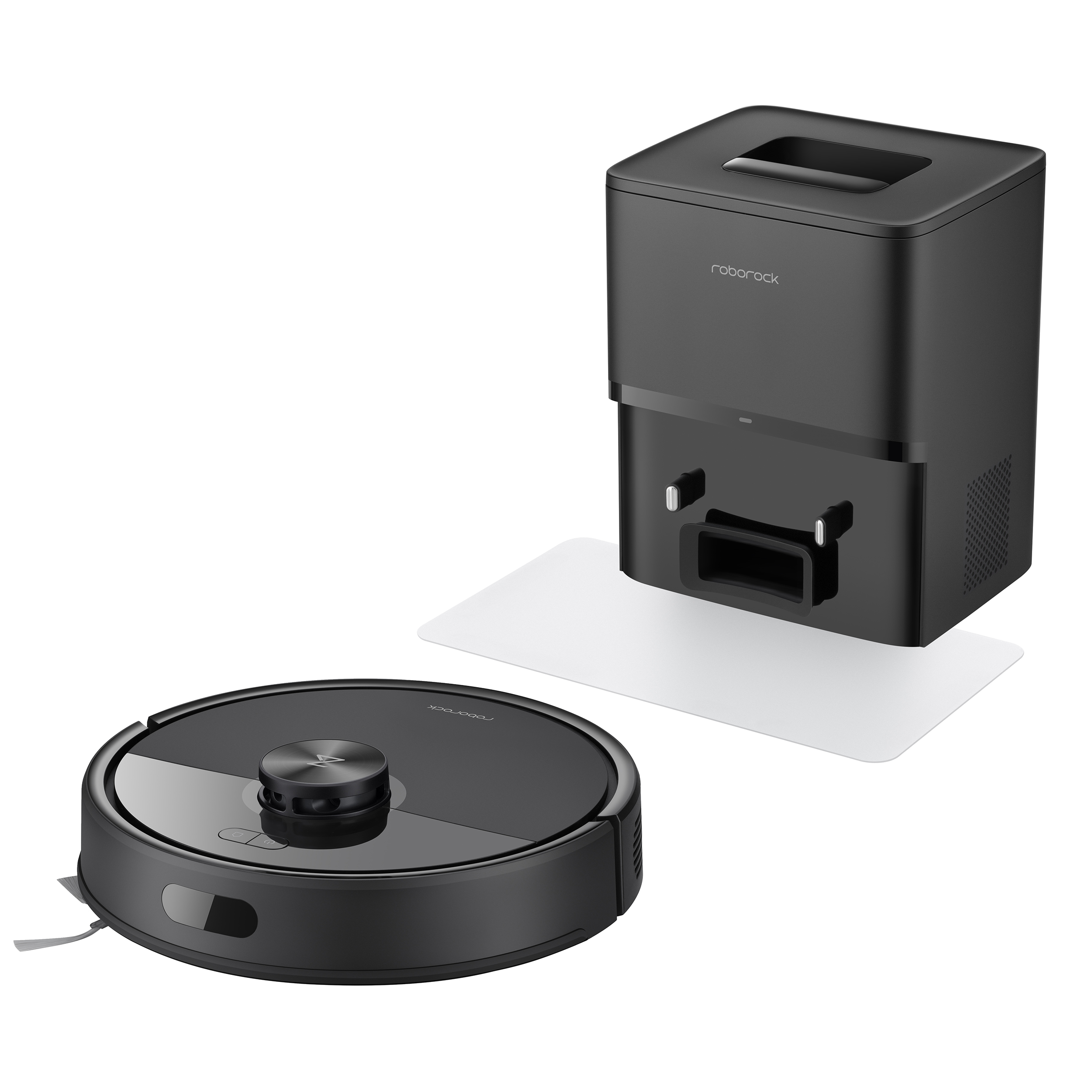 Un aspirateur robot noir et une station de charge sur fond blanc. L'aspirateur est de forme ronde.