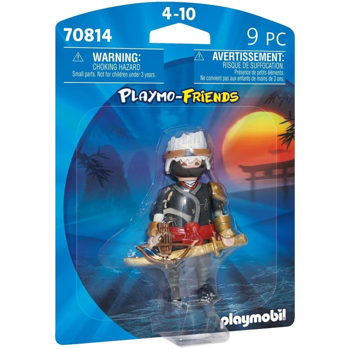 Un personaggio ninja Playmobil in un blister. Il ninja indossa un completo nero e oro, una maschera e tiene in mano un'arma.