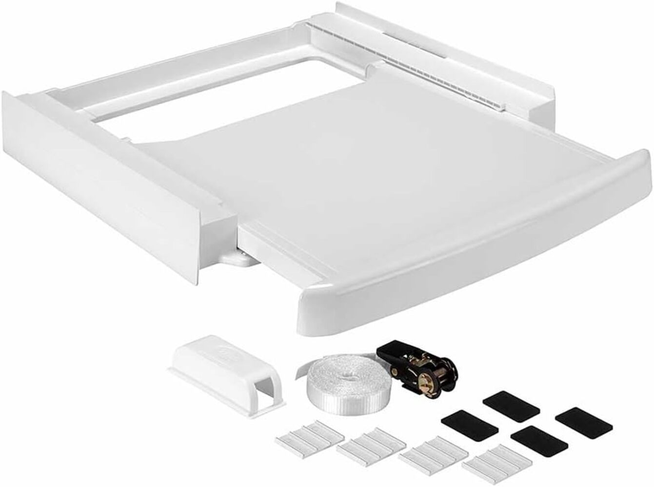 Base blanca de lavadora con varios accesorios: correas, clips y almohadillas, sobre una superficie blanca.