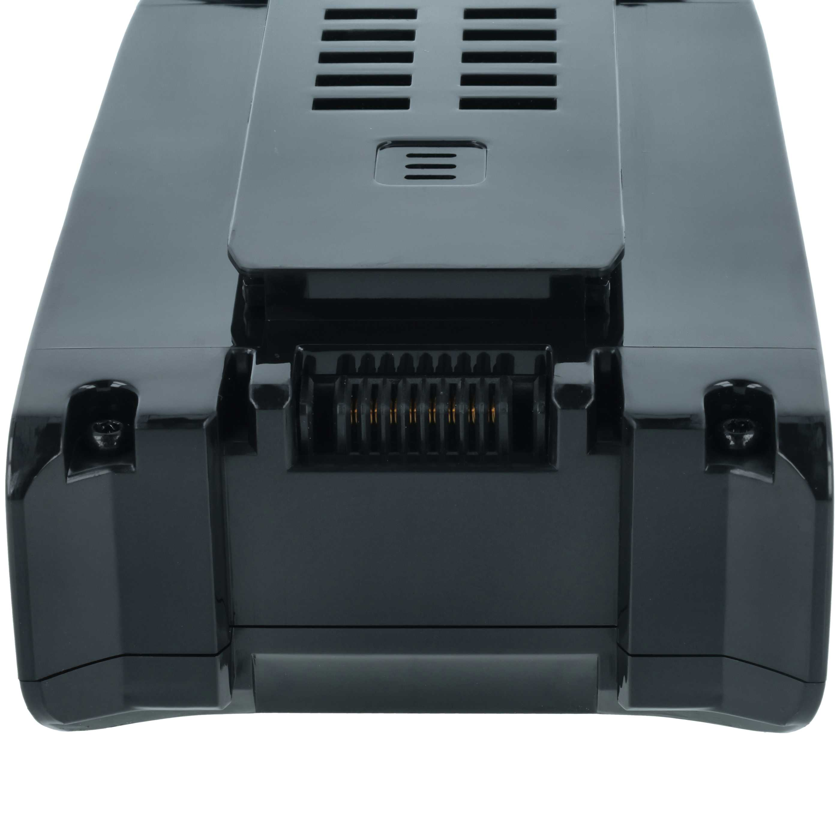 Ein schwarzes, rechteckiges elektronisches Gerät. Es hat einen oberen Abschnitt mit Lüftungsschlitzen und ein Mittelpaneel mit drei horizontalen Linien.