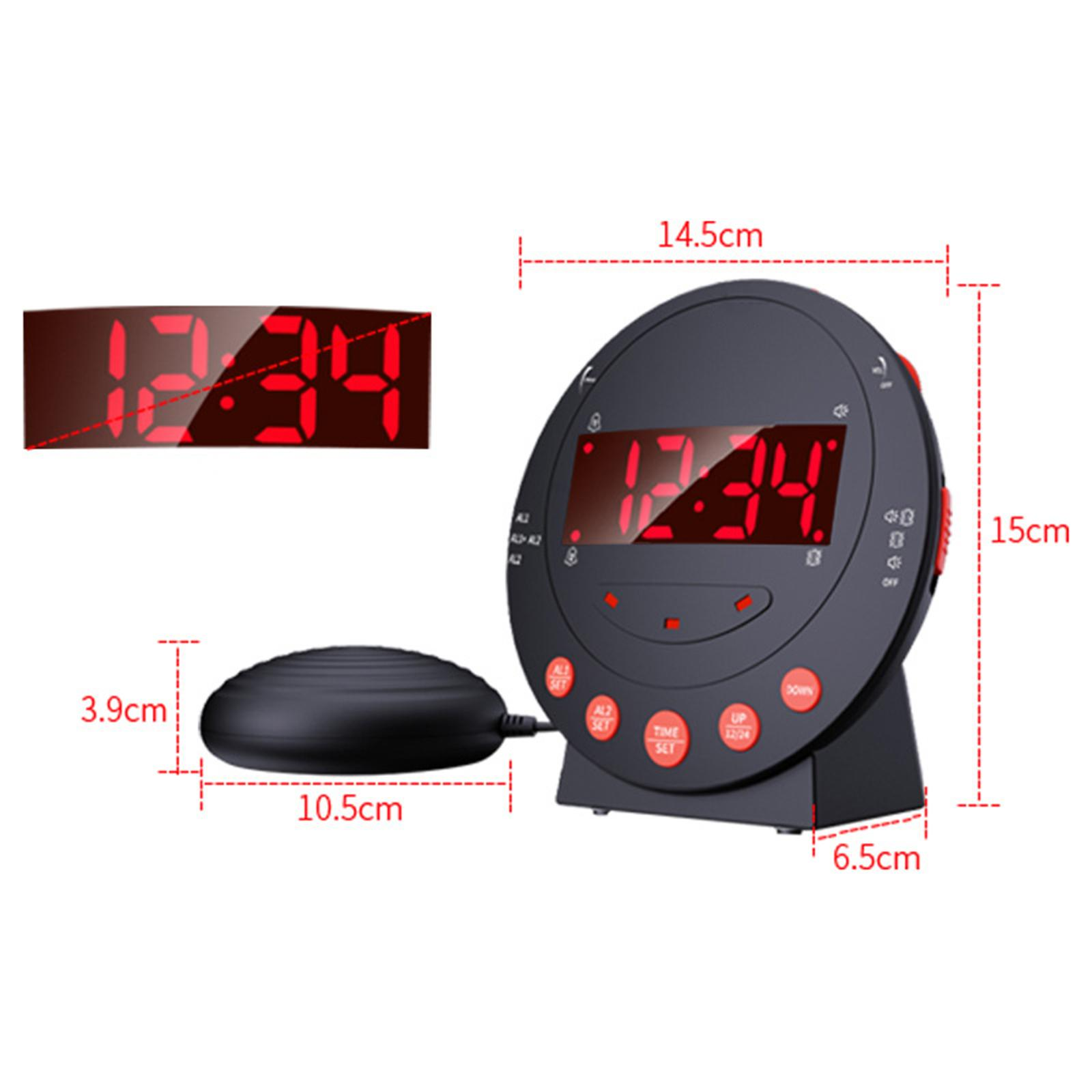 Schwarzer digitaler Wecker mit der Anzeige 12:34. Enthält ein Vibrationspad, und die Abmessungen sind in cm angegeben.