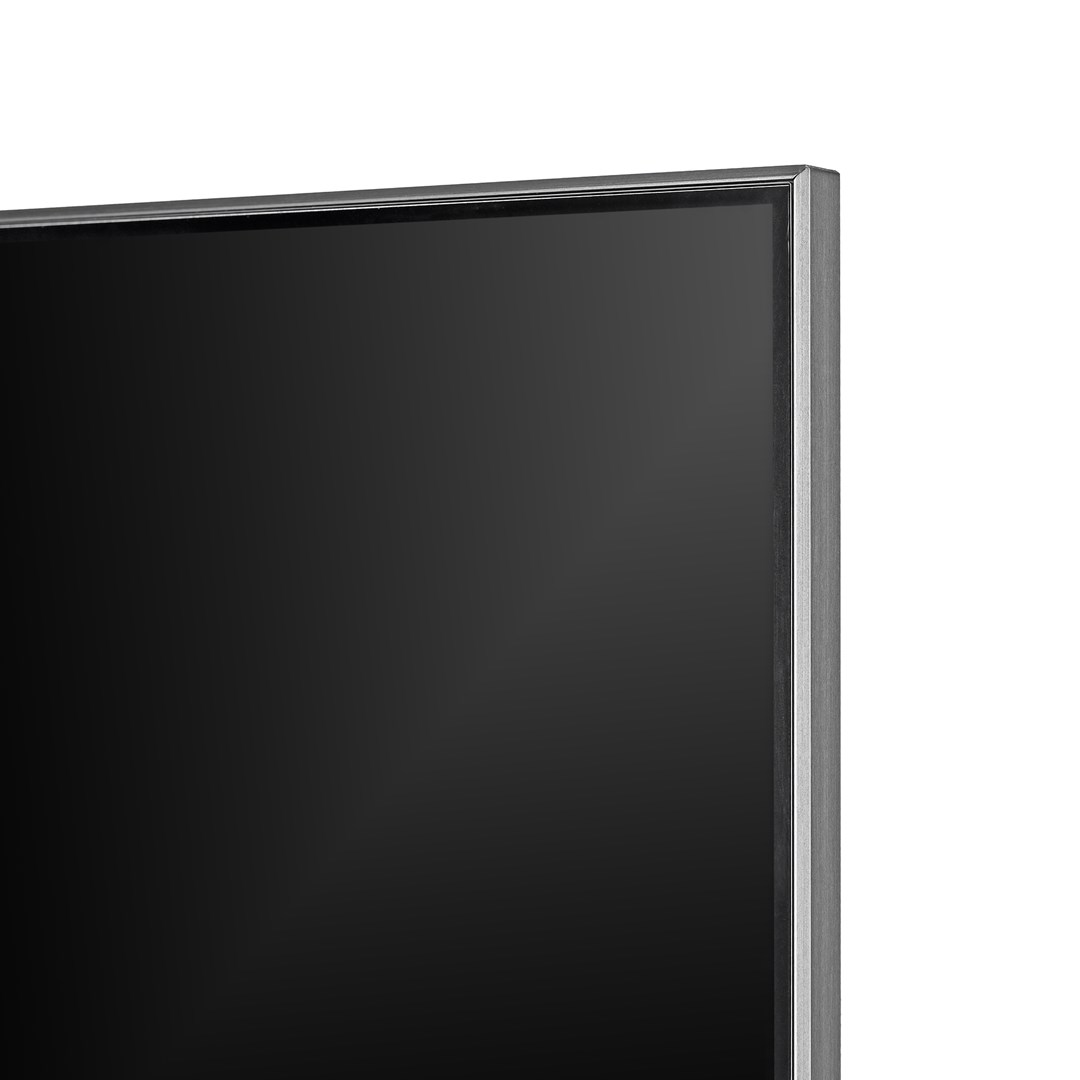 Close-up of a dark, rectangular TV screen with a silver frame on a white background. The screen is off, showing a black surface.