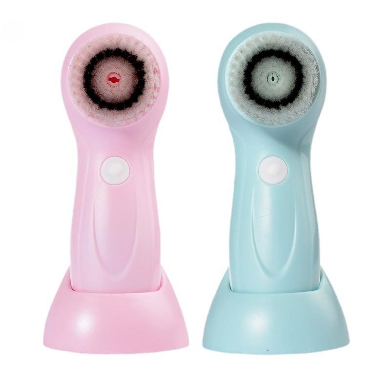 Zwei Gesichtsreinigungsbürsten, eine rosa und eine blaue. Jede hat einen Bürstenkopf und einen Sockel. Die rosa ist links.