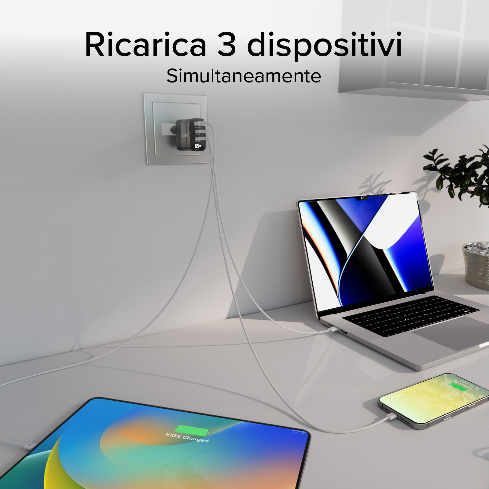 Trzy urządzenia ładujące się jednocześnie: laptop, tablet i telefon, wszystkie podłączone do ładowarki ściennej.