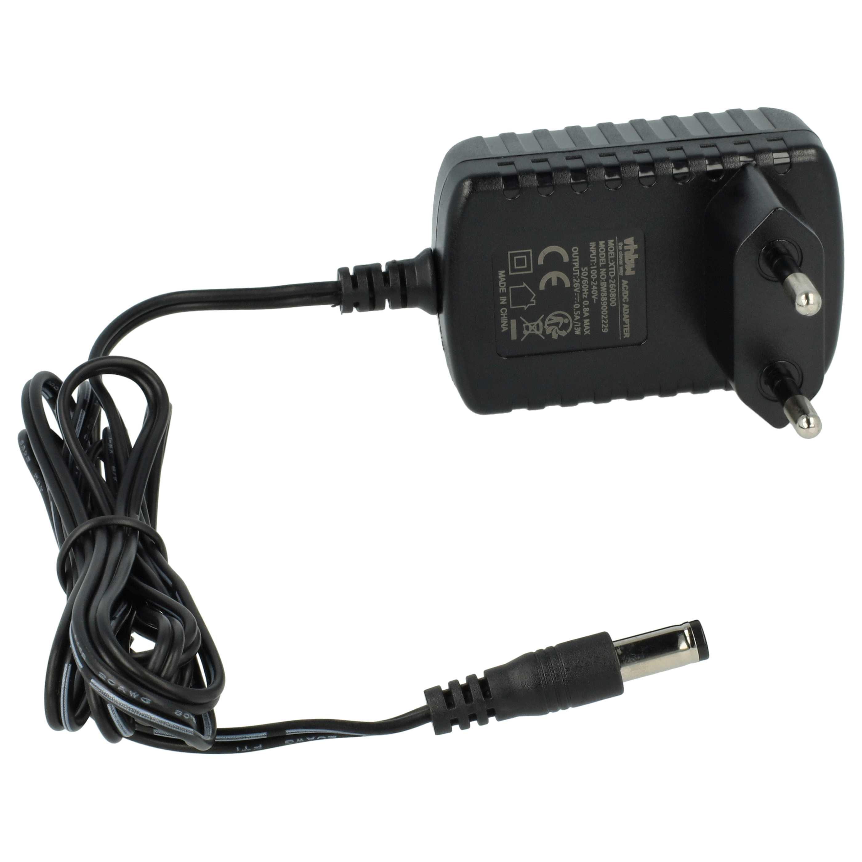 Ein schwarzes AC/DC-Netzteil mit Netzstecker und Gleichstromkabel. Der Adapter hat Text und Symbole.