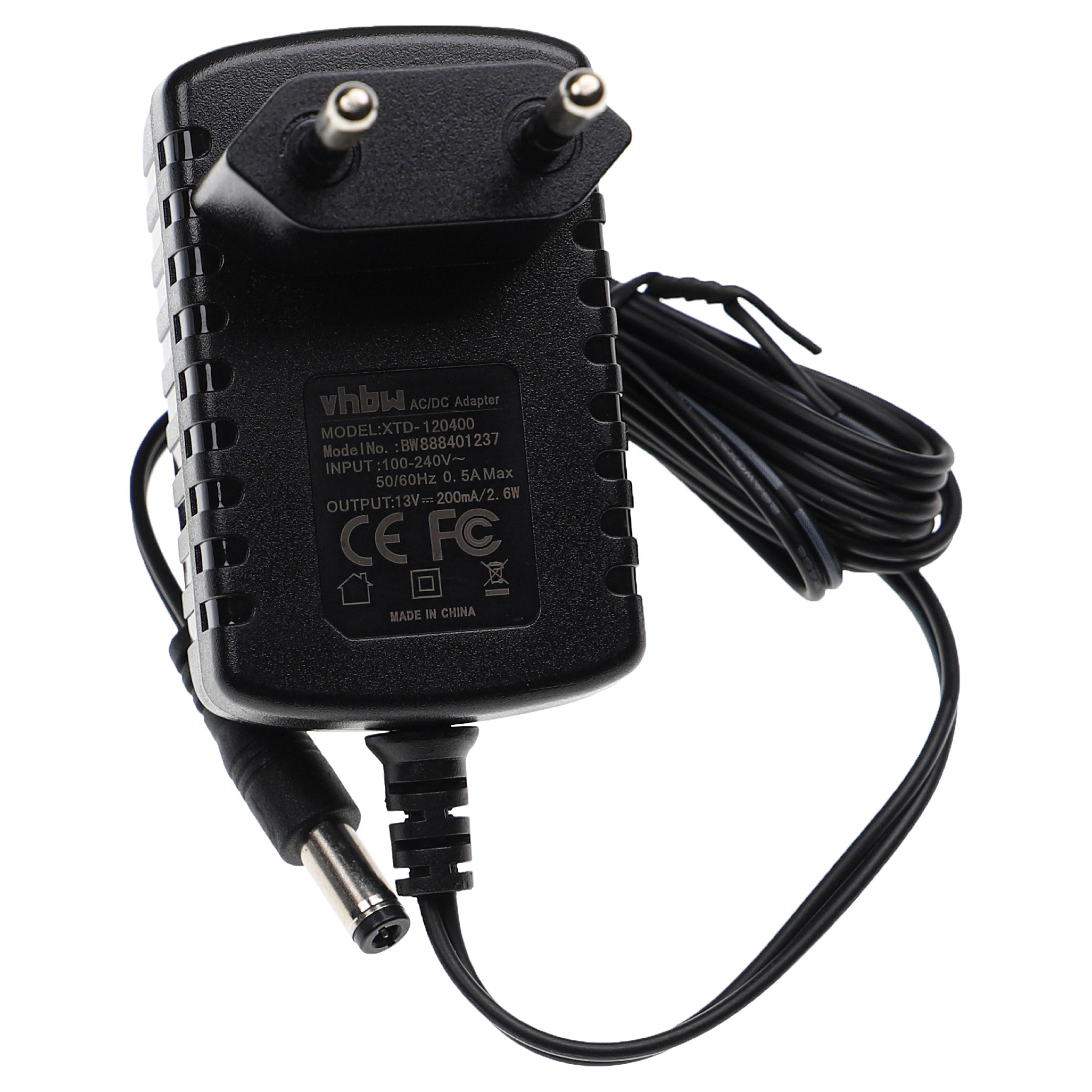 Schwarzes AC/DC-Netzteil mit Stecker und Kabel. Es hat Text und einen DC-Anschluss.