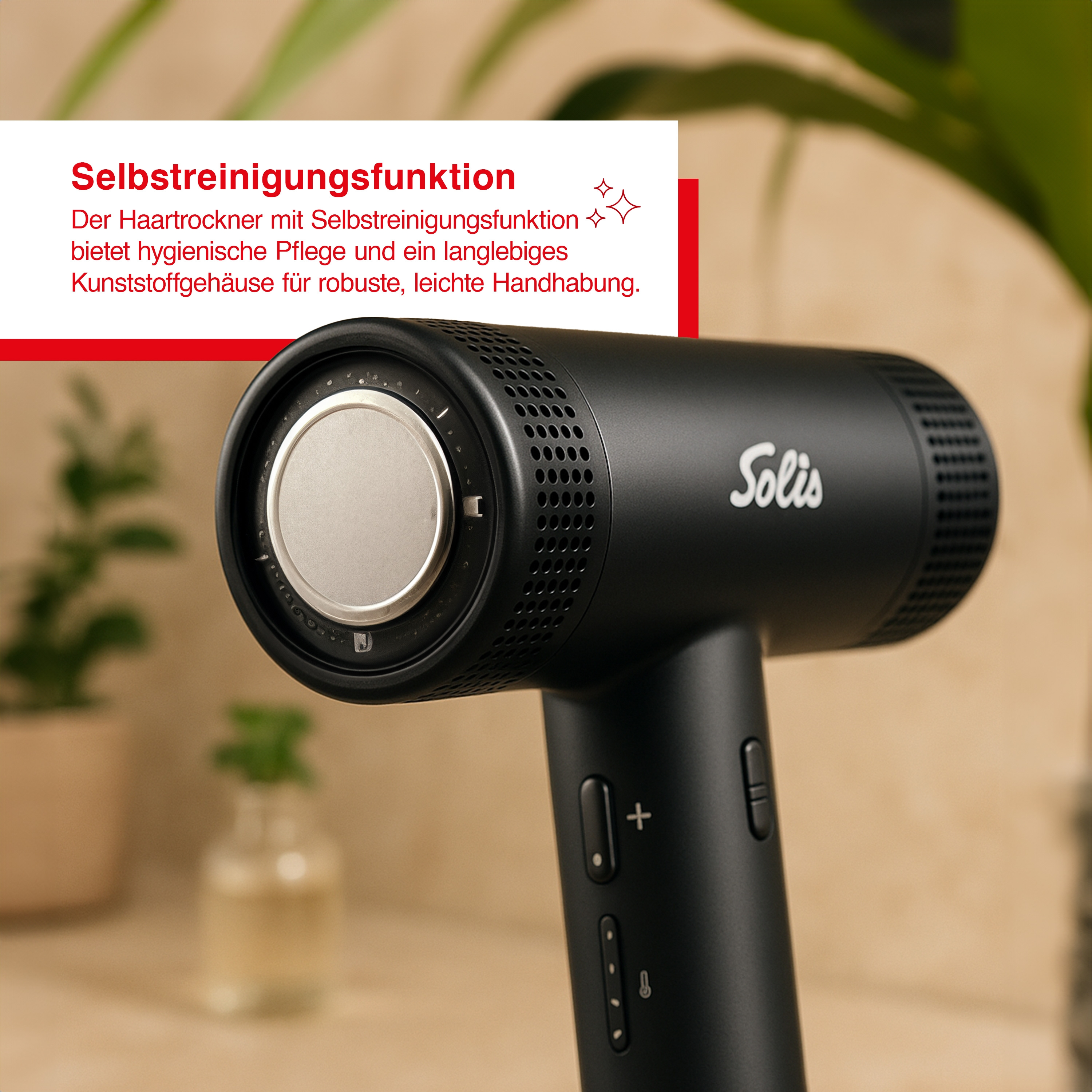 Schwarzer Haartrockner mit silbernen Akzenten. Er hat Knöpfe und die Marke Solis. Text auf Deutsch ist sichtbar.