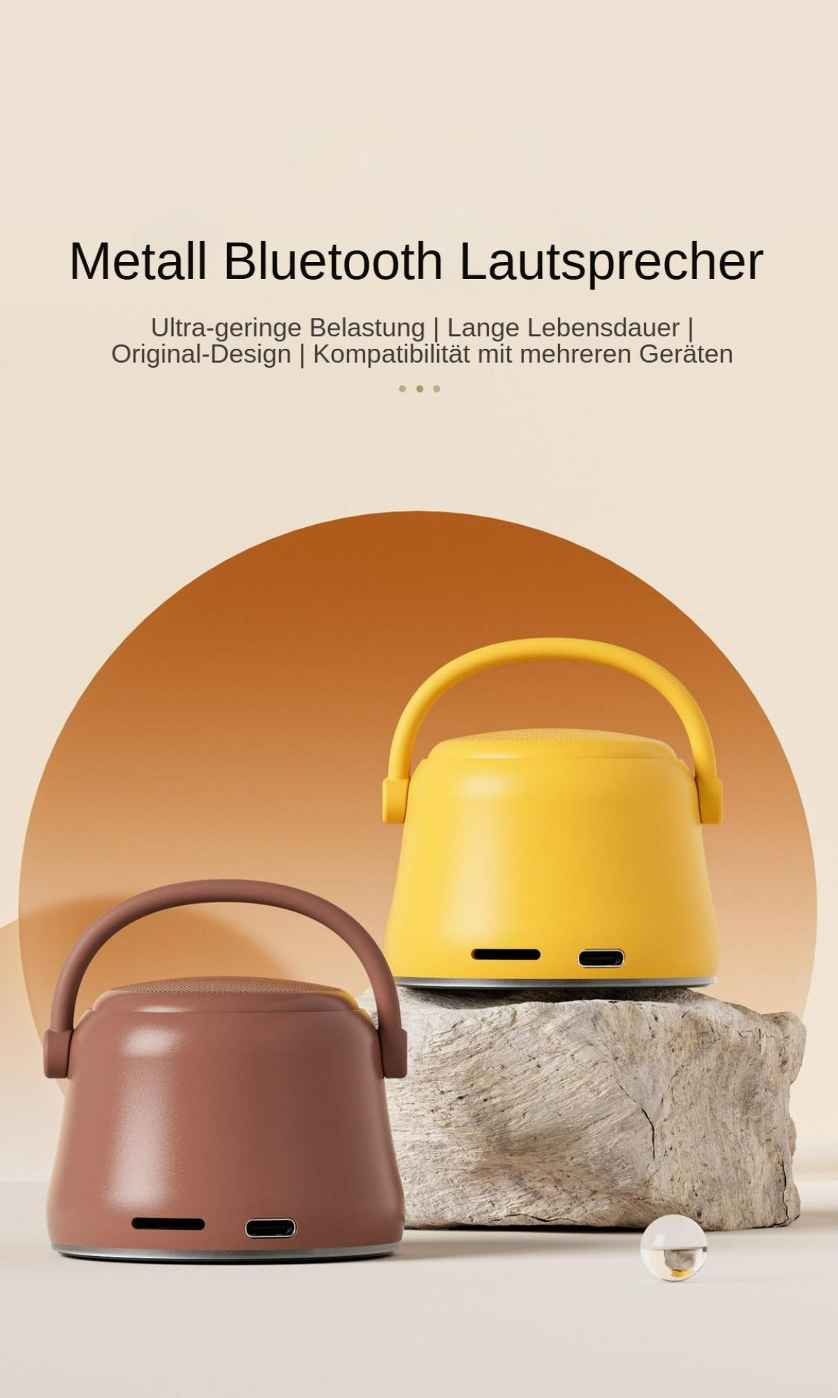 Zwei Lautsprecher, braun und gelb, mit Griffen, stehen auf einem Felsen. Der Text oben lautet 'Metall Bluetooth Lautsprecher'.