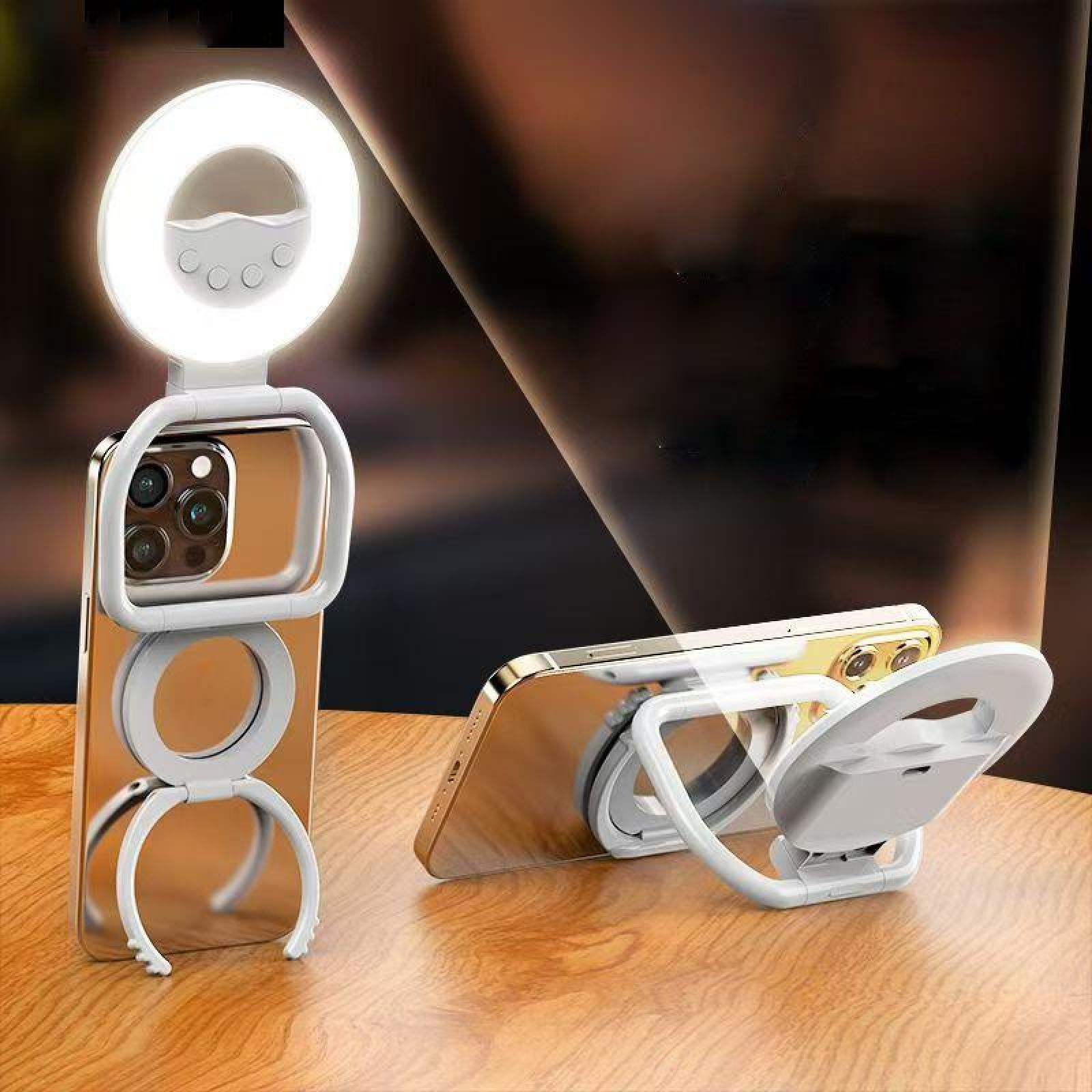 Ein Telefon mit Ringlicht und Ständer. Das Telefon ist goldfarben und das Ringlicht weiß. Es steht auf einer Holzoberfläche.