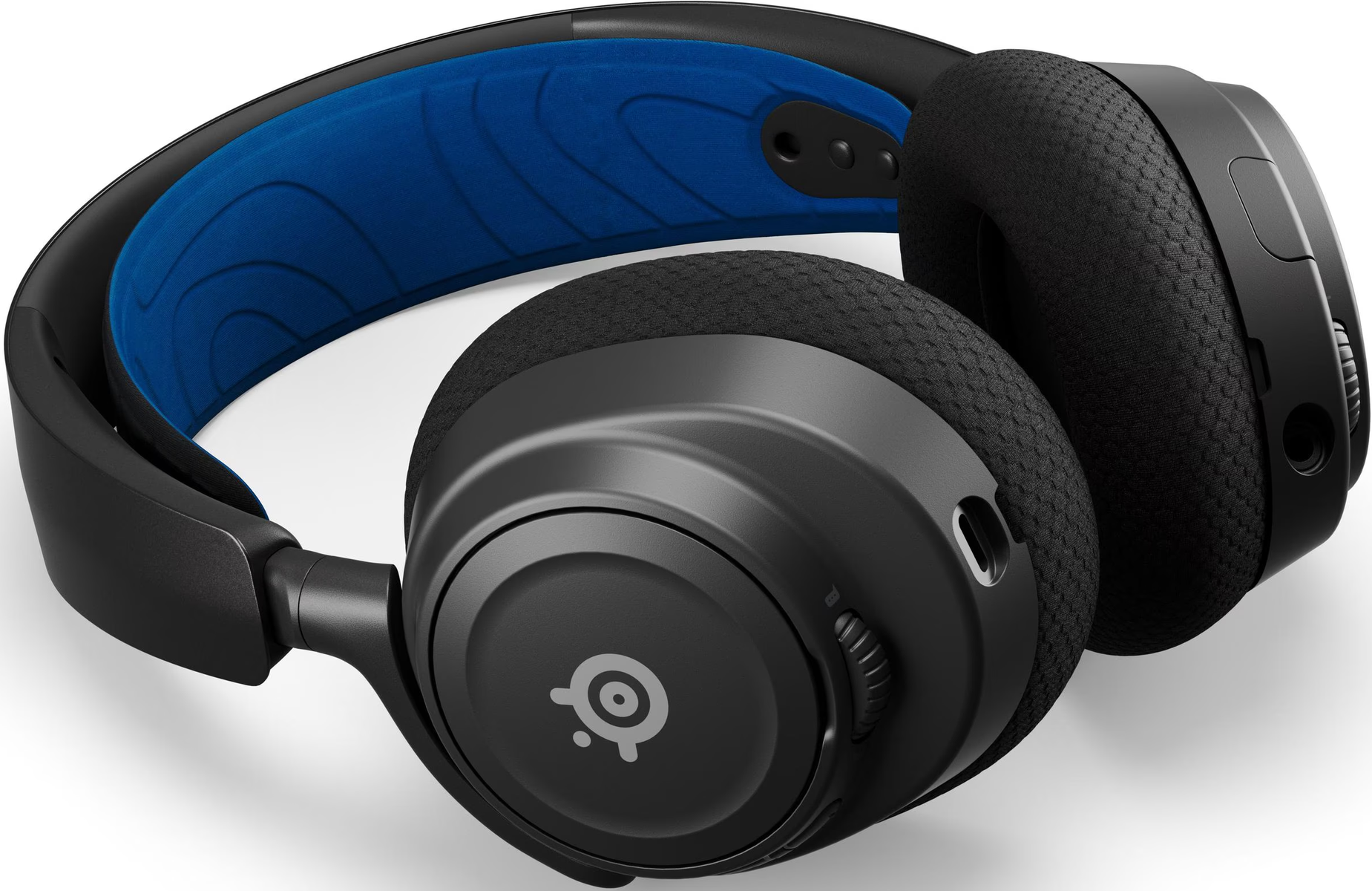 Cuffie nere con imbottitura blu sull'archetto. I padiglioni sono neri e circolari. È visibile una manopola del volume.