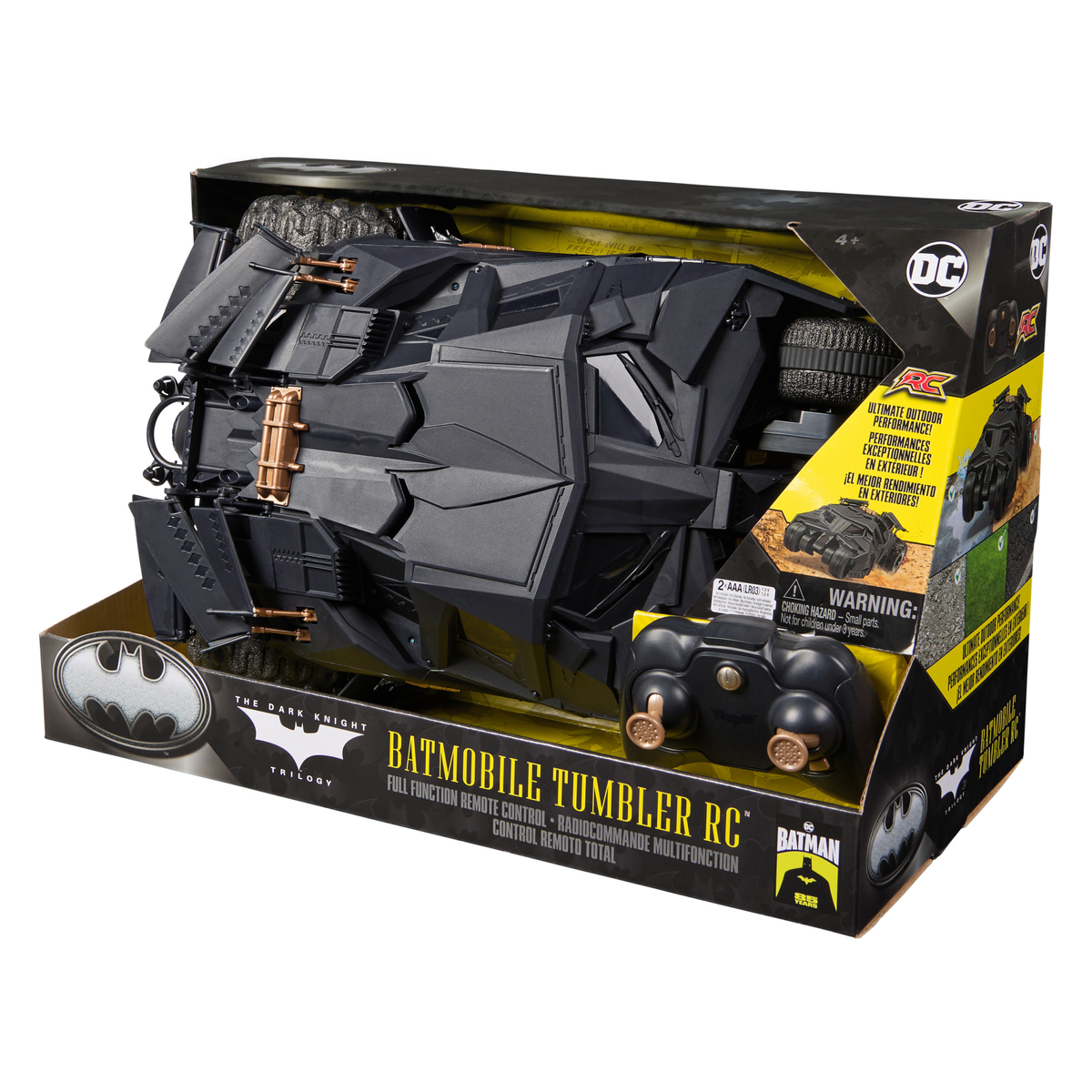 Un juguete Batmobile Tumbler RC en su caja. El vehículo negro está en primer plano con la caja que muestra la marca y los detalles de Batman.