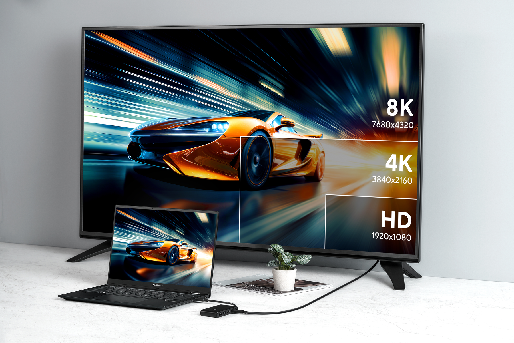 A TV displays a car image. A laptop next to it shows the same image. Different resolution options are marked on the screen.