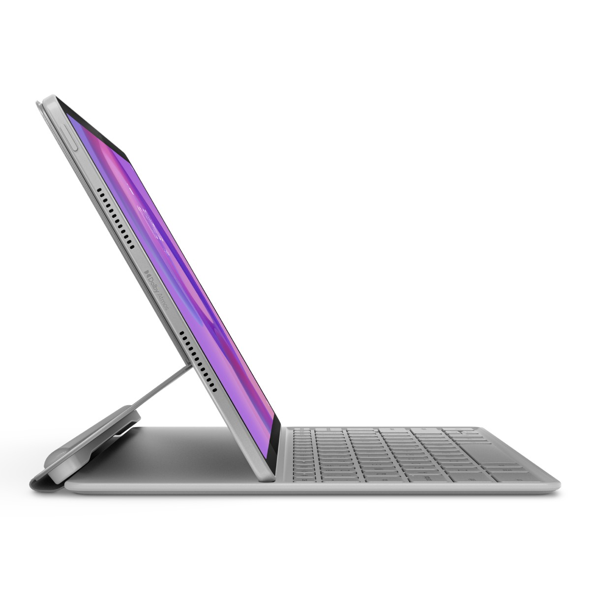Un tablet argentato con tastiera è aperto. Lo schermo mostra una sfumatura viola. La tastiera è grigia e lo sfondo bianco.