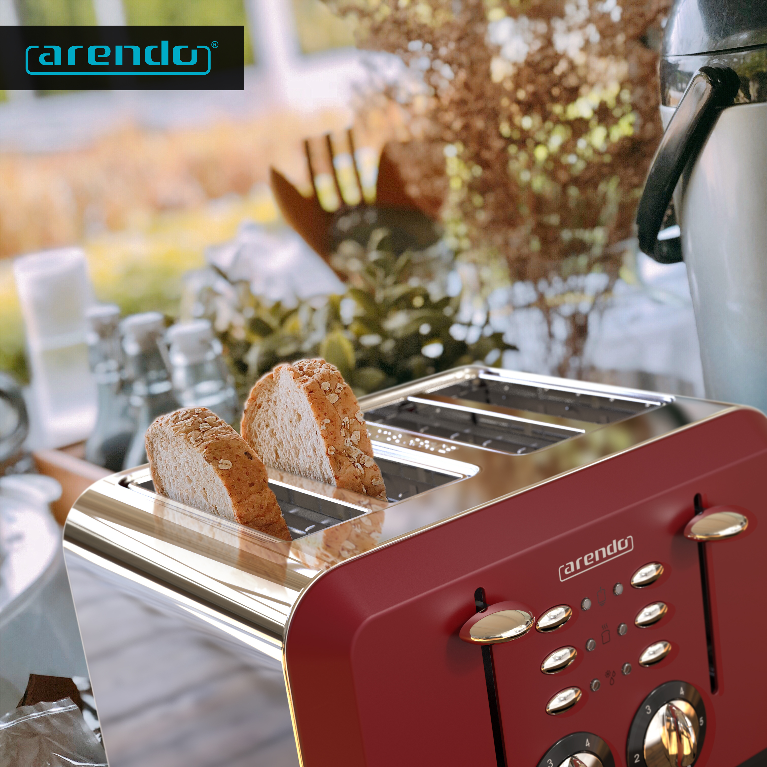 Ein roter Toaster mit zwei Brotscheiben. Der Hintergrund hat verschwommenes Grün.