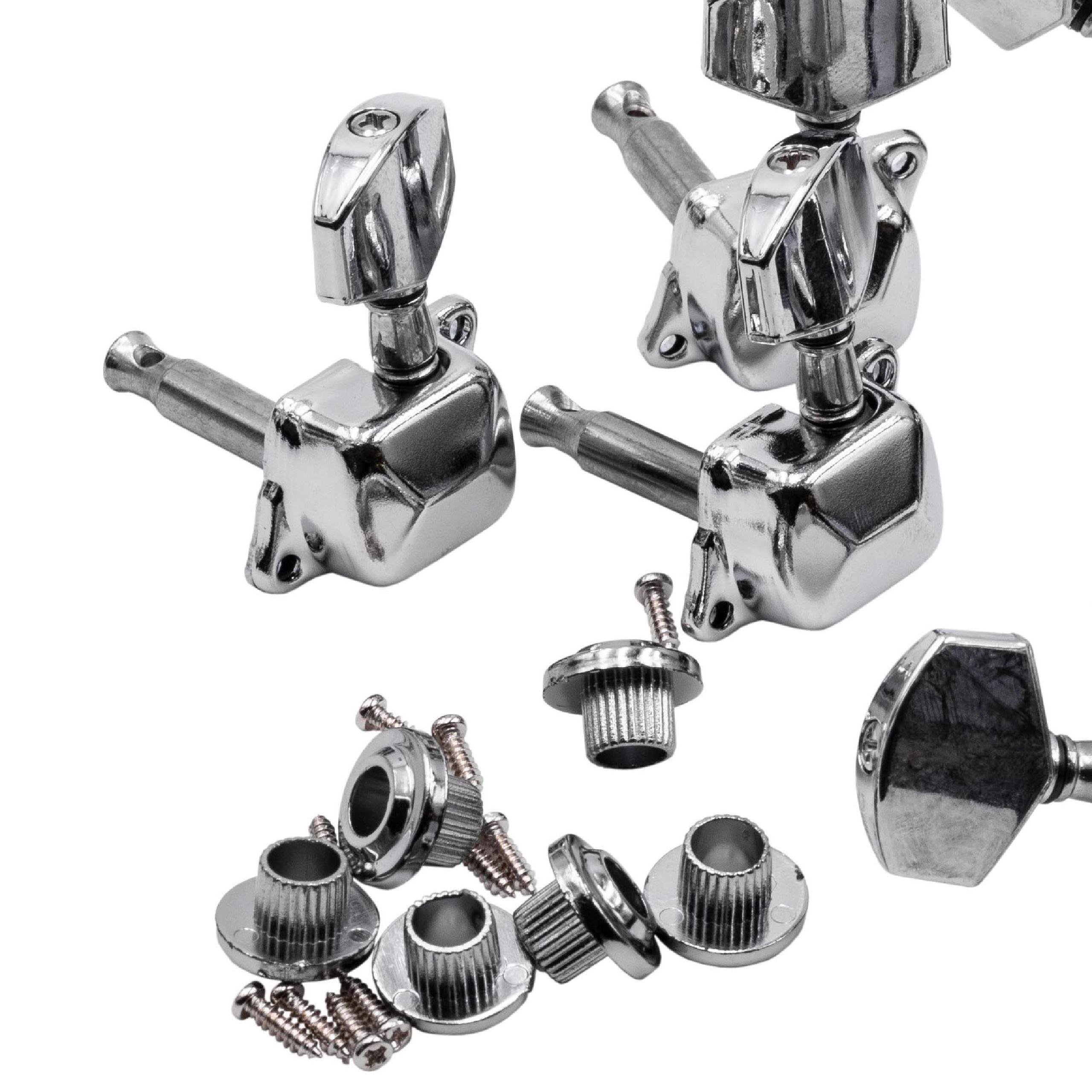 Nahaufnahme von Gitarrenstimmwirbeln und zugehöriger Hardware. Silberne Metallteile auf weißem Hintergrund, einige Schrauben sind sichtbar.