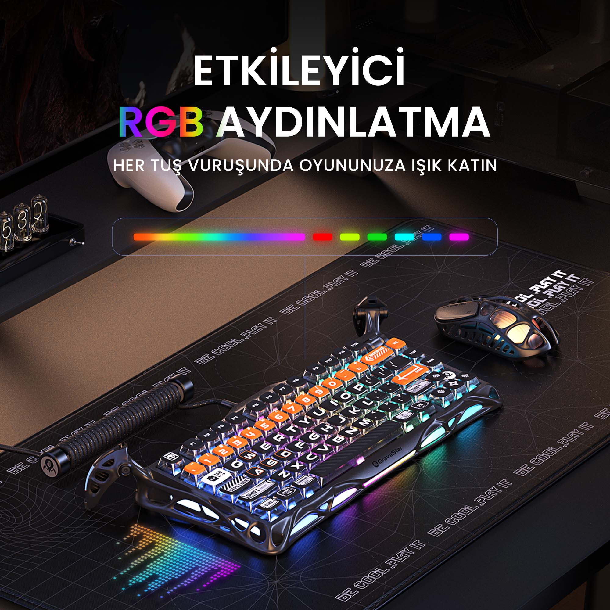 Klawiatura dla graczy z oświetleniem RGB na czarnym biurku. Zawiera mysz i gamepad.