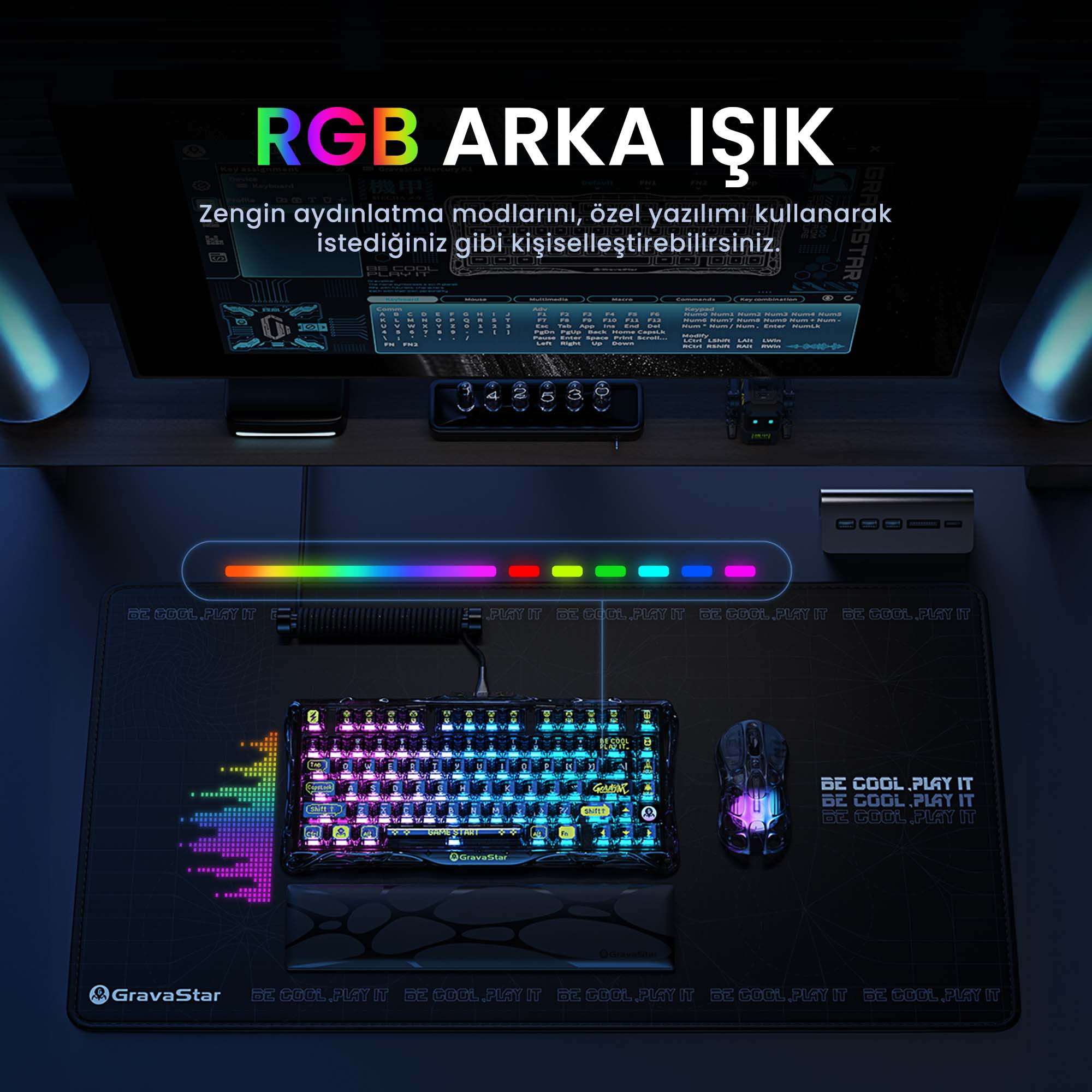 Konfiguracja do gier z klawiaturą, myszką i podkładką. Klawiatura ma światła RGB. Ekran jest w tle.