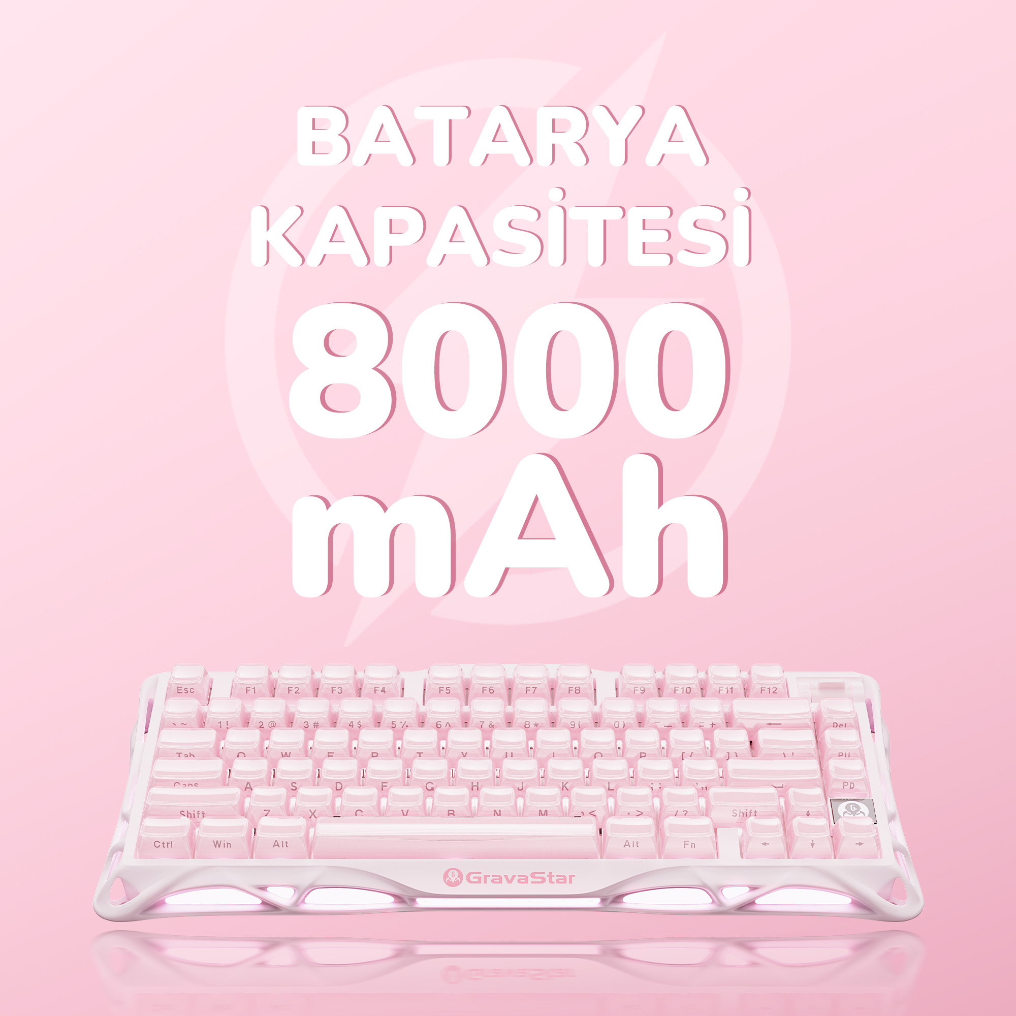 Różowa klawiatura z białymi klawiszami, tekst 'BATARYA KAPASİTESİ 8000 mAh' na różowym tle. Marka: GravaStar.