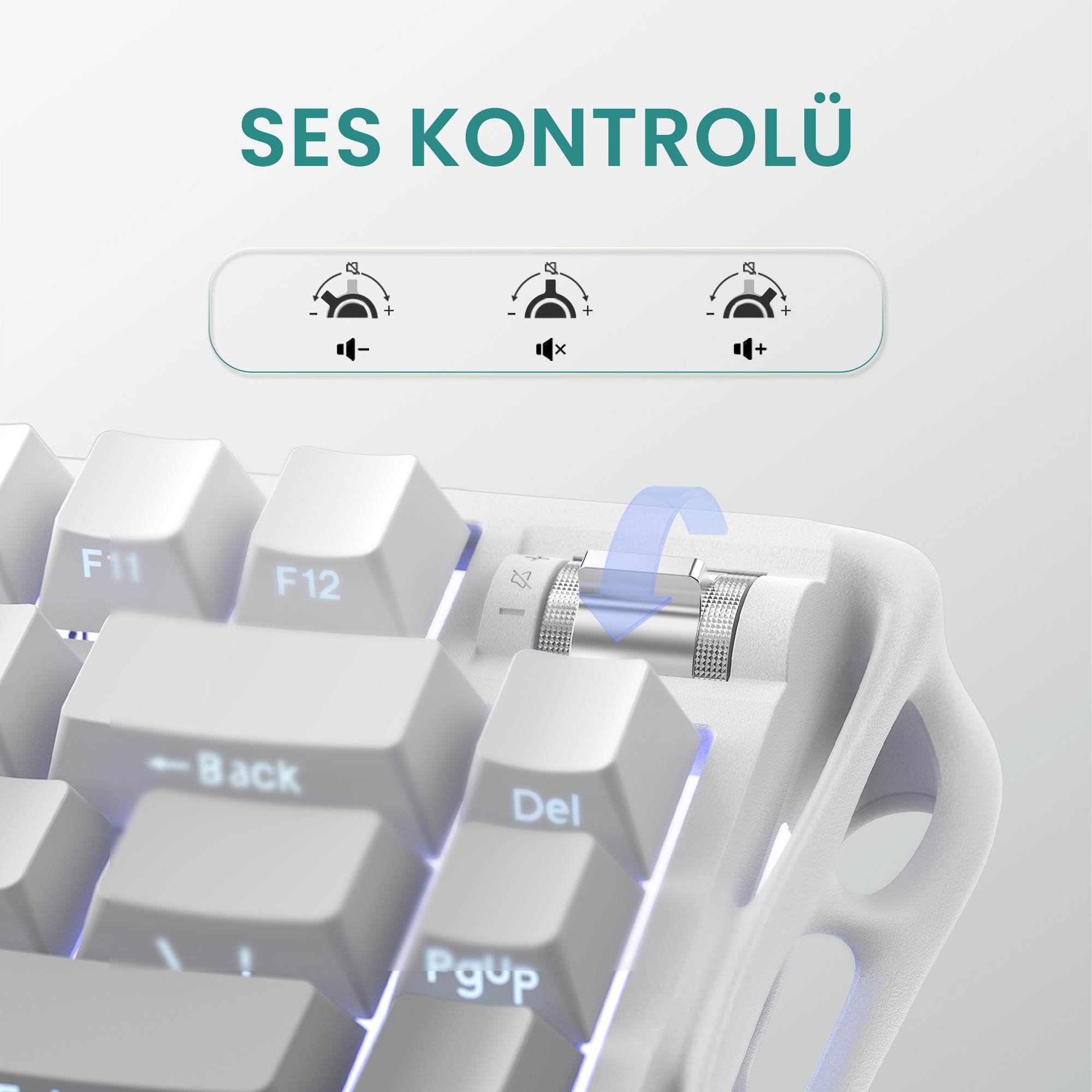 Zbliżenie białej klawiatury. Obraz przedstawia regulatory głośności i pokrętło z niebieską strzałką. Tekst: SES KONTROLÜ.