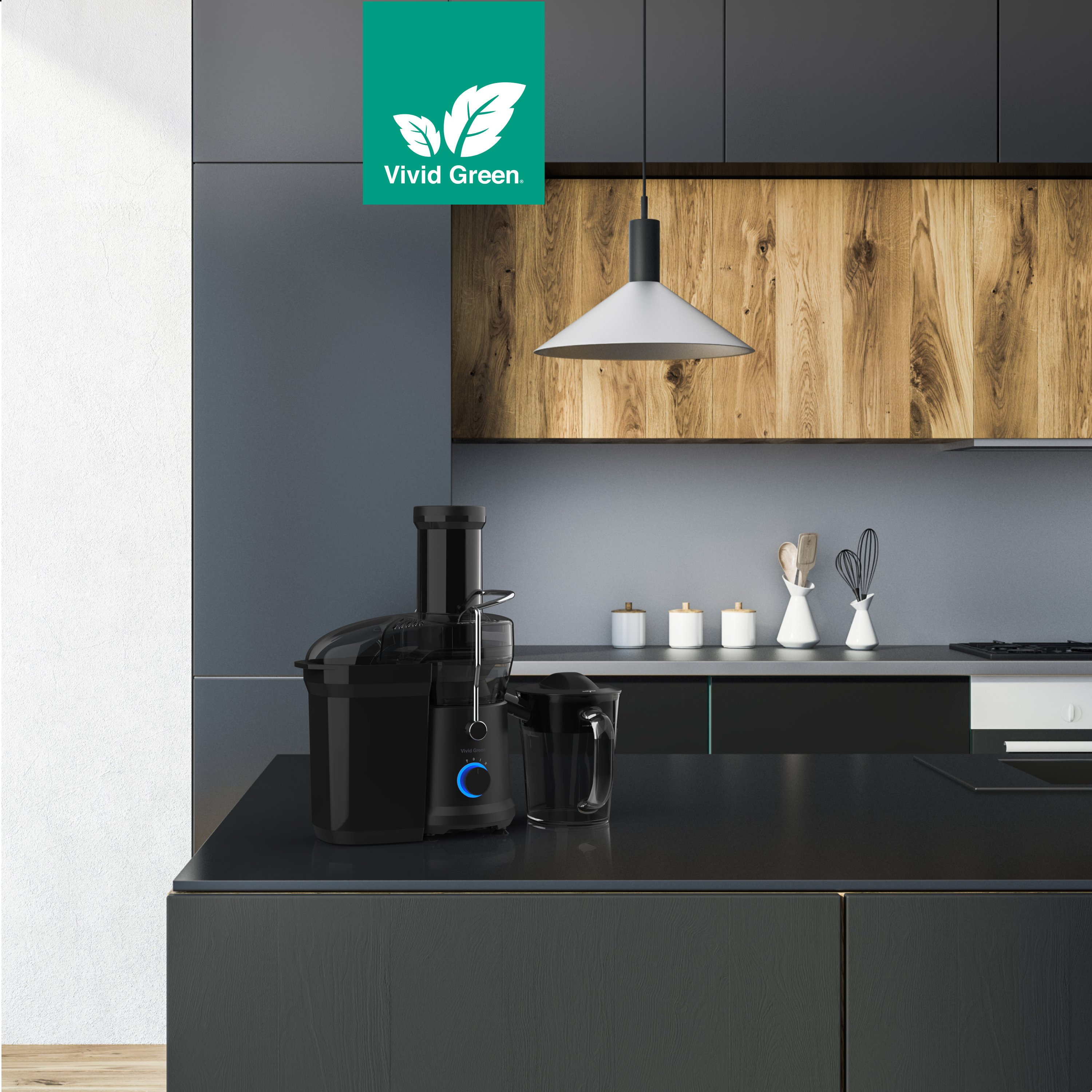 A black juicer and pitcher sit on a dark countertop in a modern kitchen. Cabinets of wood and gray are behind.