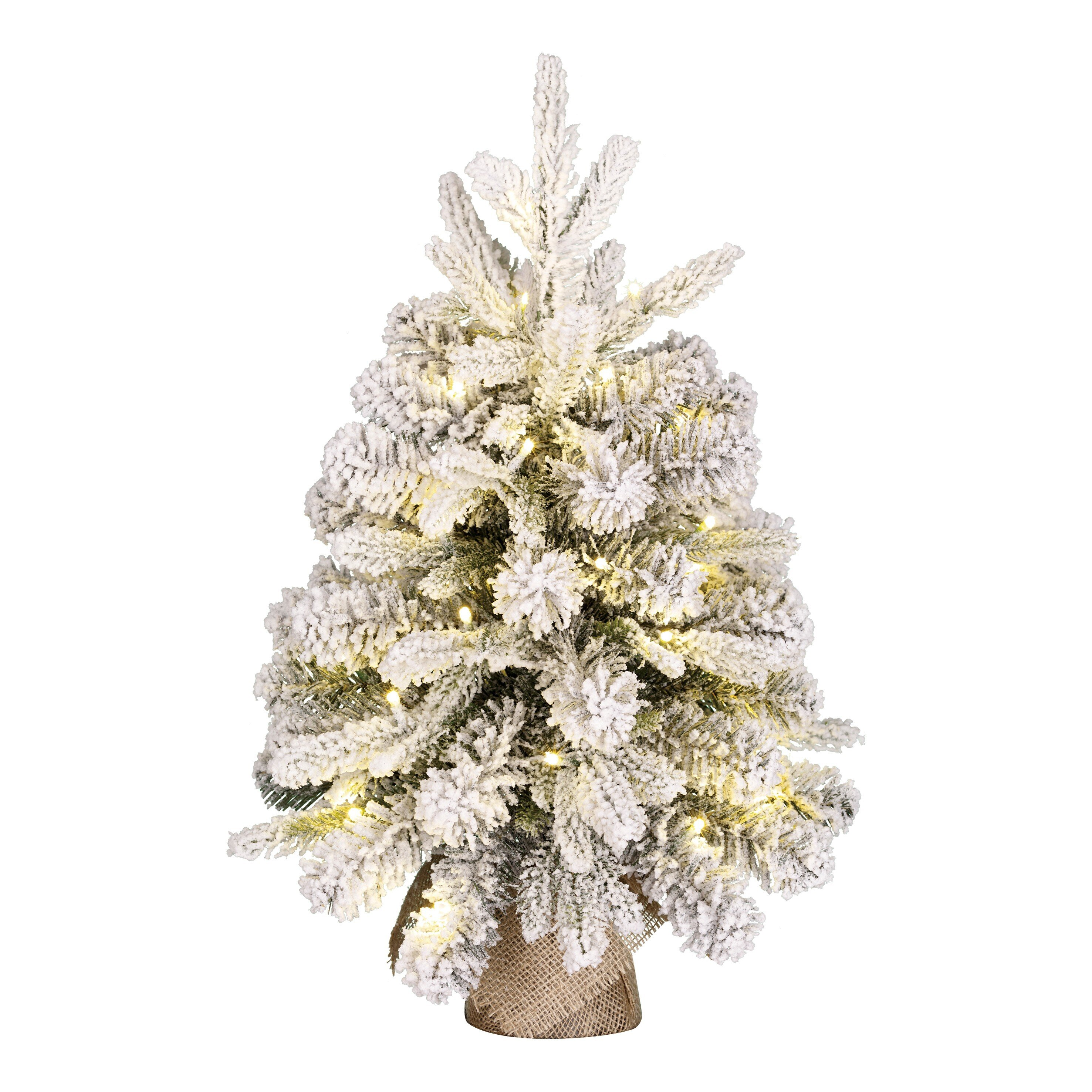 Un petit sapin de Noël blanc, avec des lumières chaudes et une base en toile de jute, sur fond blanc.