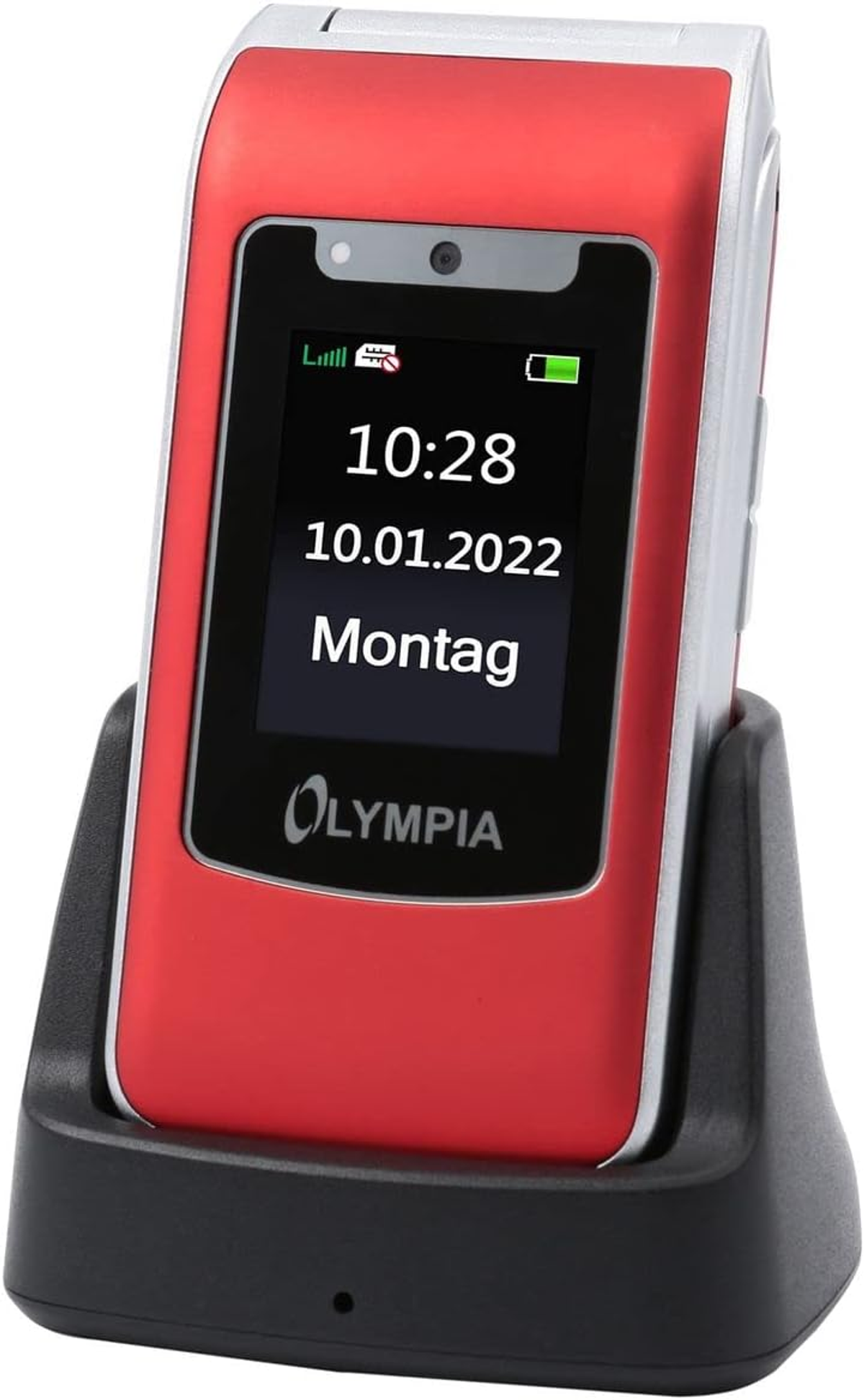Ein rotes Olympia-Klapphandy in einer schwarzen Ladestation. Der Bildschirm zeigt Uhrzeit, Datum und Montag.