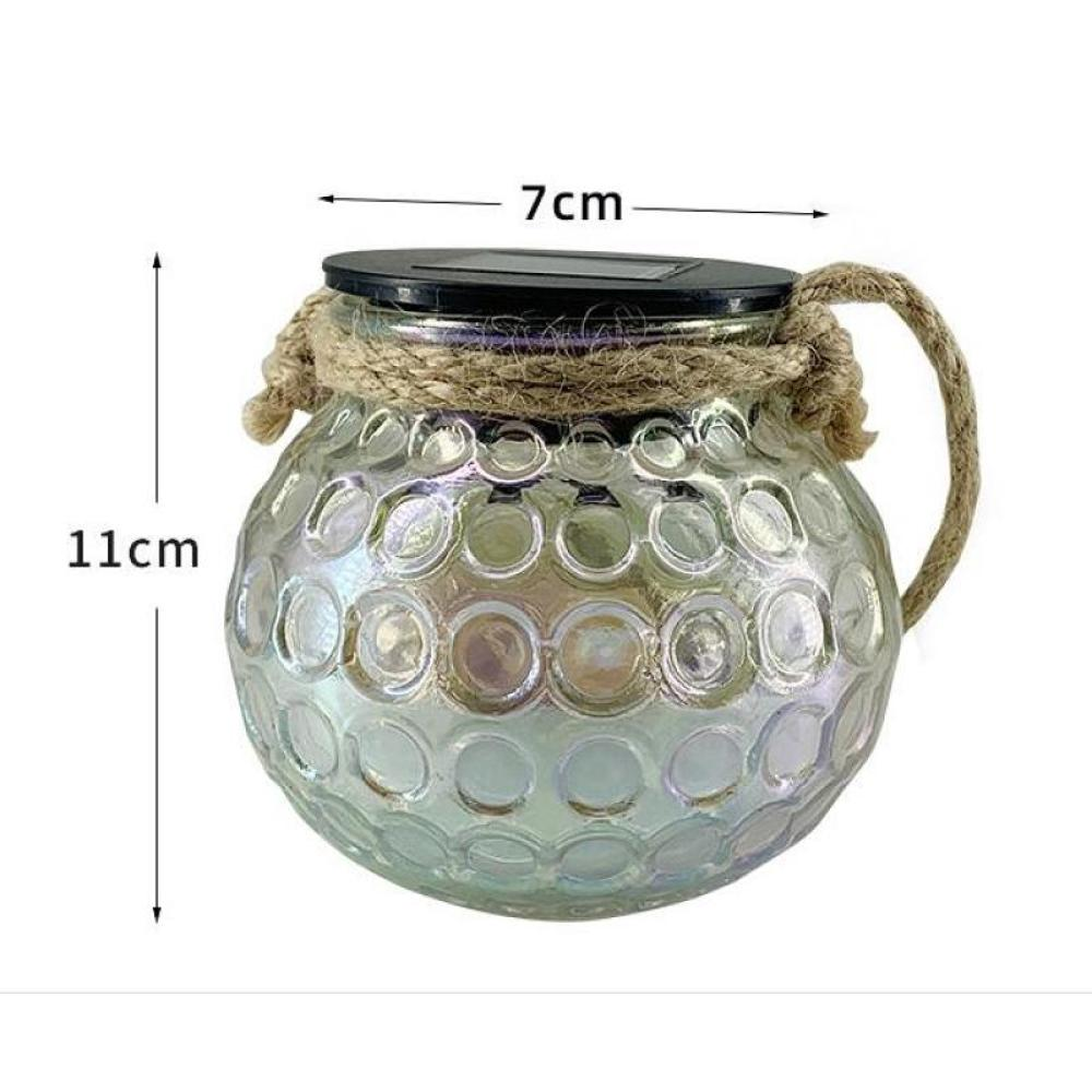 Ein klares Glasgefäß mit dekorativen Kreisen, Seilgriff und schwarzem Deckel. Die Abmessungen betragen 7 cm Breite und 11 cm Höhe.