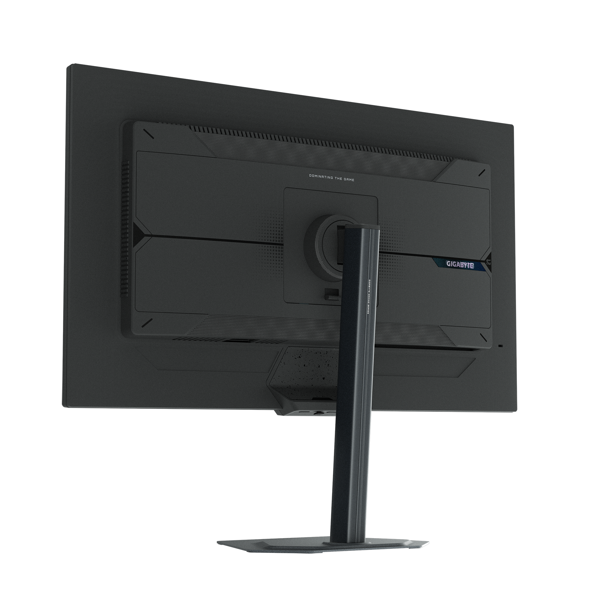 Widok z tyłu czarnego monitora komputerowego. Na ekranie widnieje napis 'DOMINATING THE GAME' i logo 'GIGABYTE'.