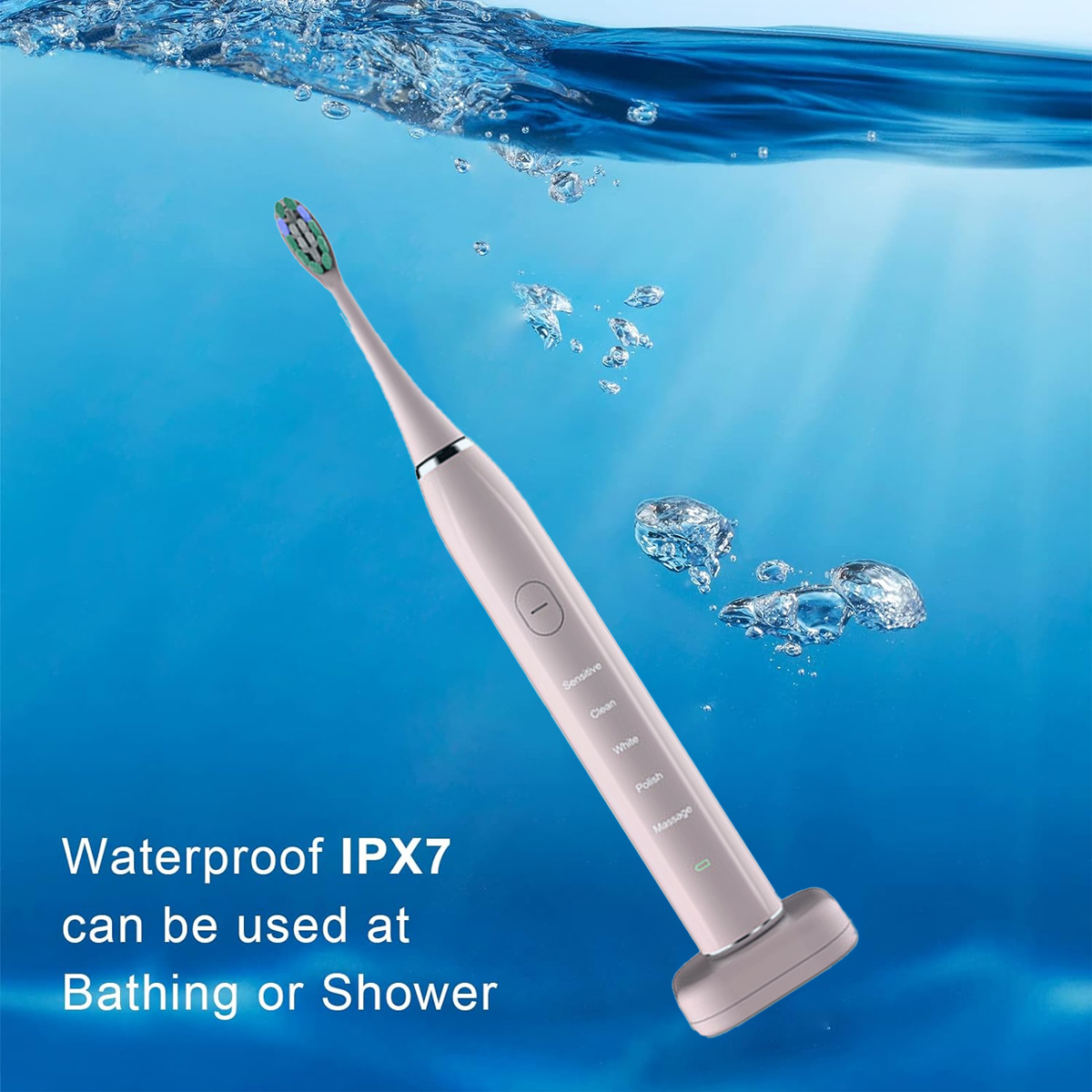 Eine rosa elektrische Zahnbürste, die in Wasser getaucht ist und von Blasen umgeben ist. Text: Wasserdicht IPX7 kann beim Baden oder Duschen verwendet werden.