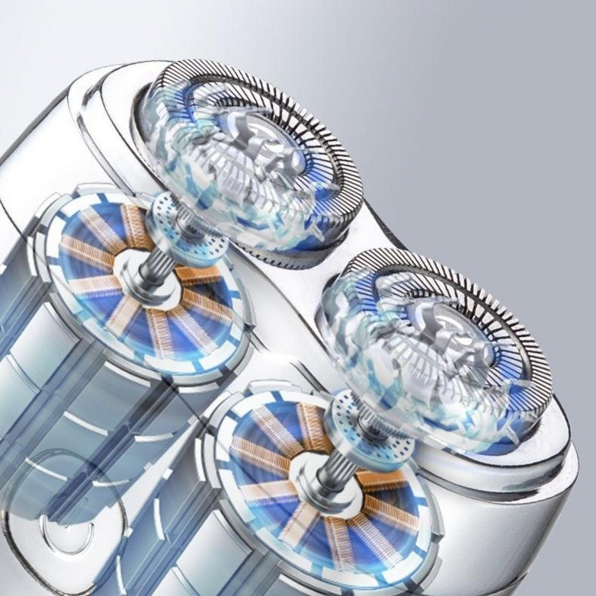 Nahaufnahme eines Elektrorasiererkopfes. Klingen, Rotoren und der innere Mechanismus sind sichtbar. Blau, Gold und Silber dominieren das Design.