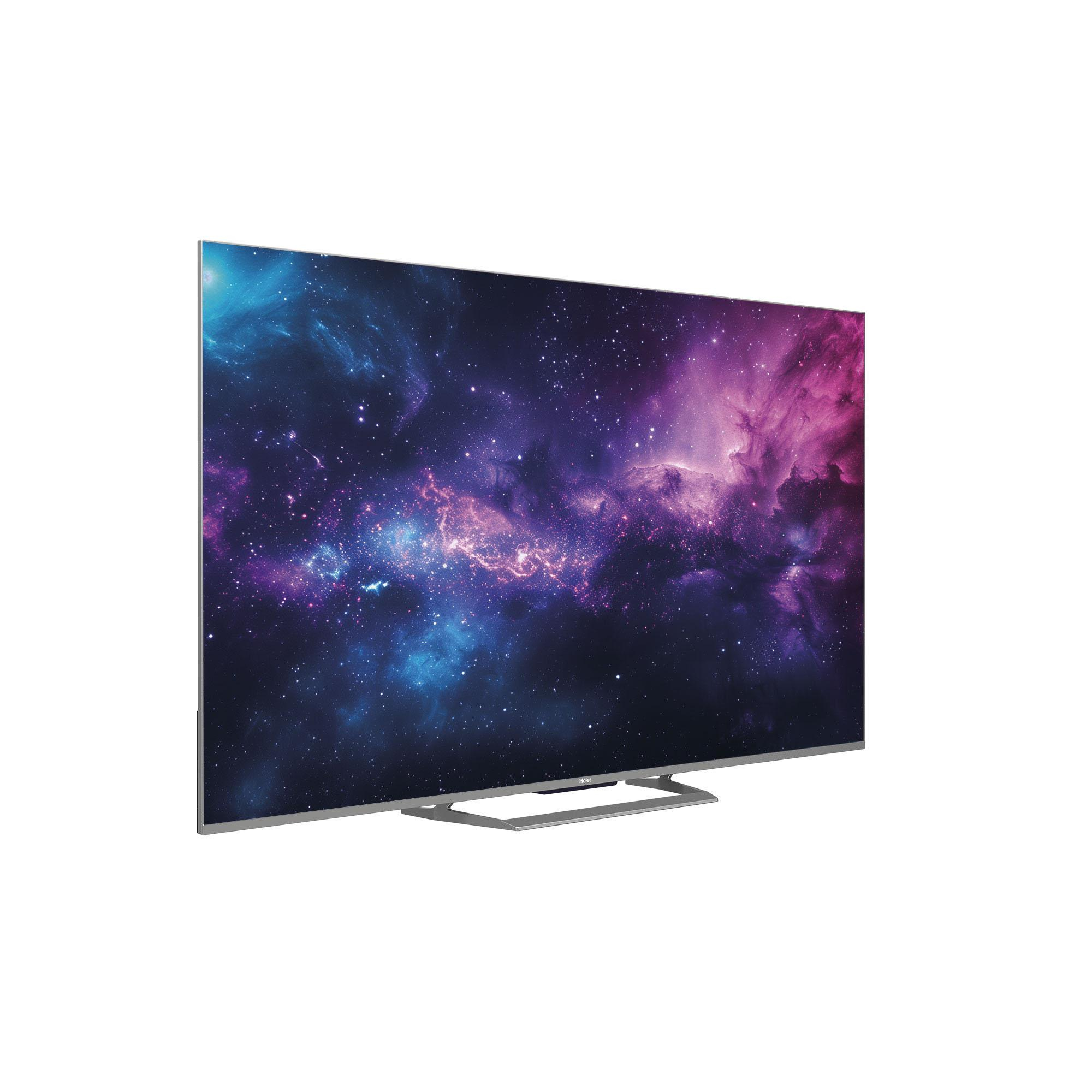 Un téléviseur à écran plat affiche une image de galaxie vibrante. Il repose sur un support sur fond blanc.