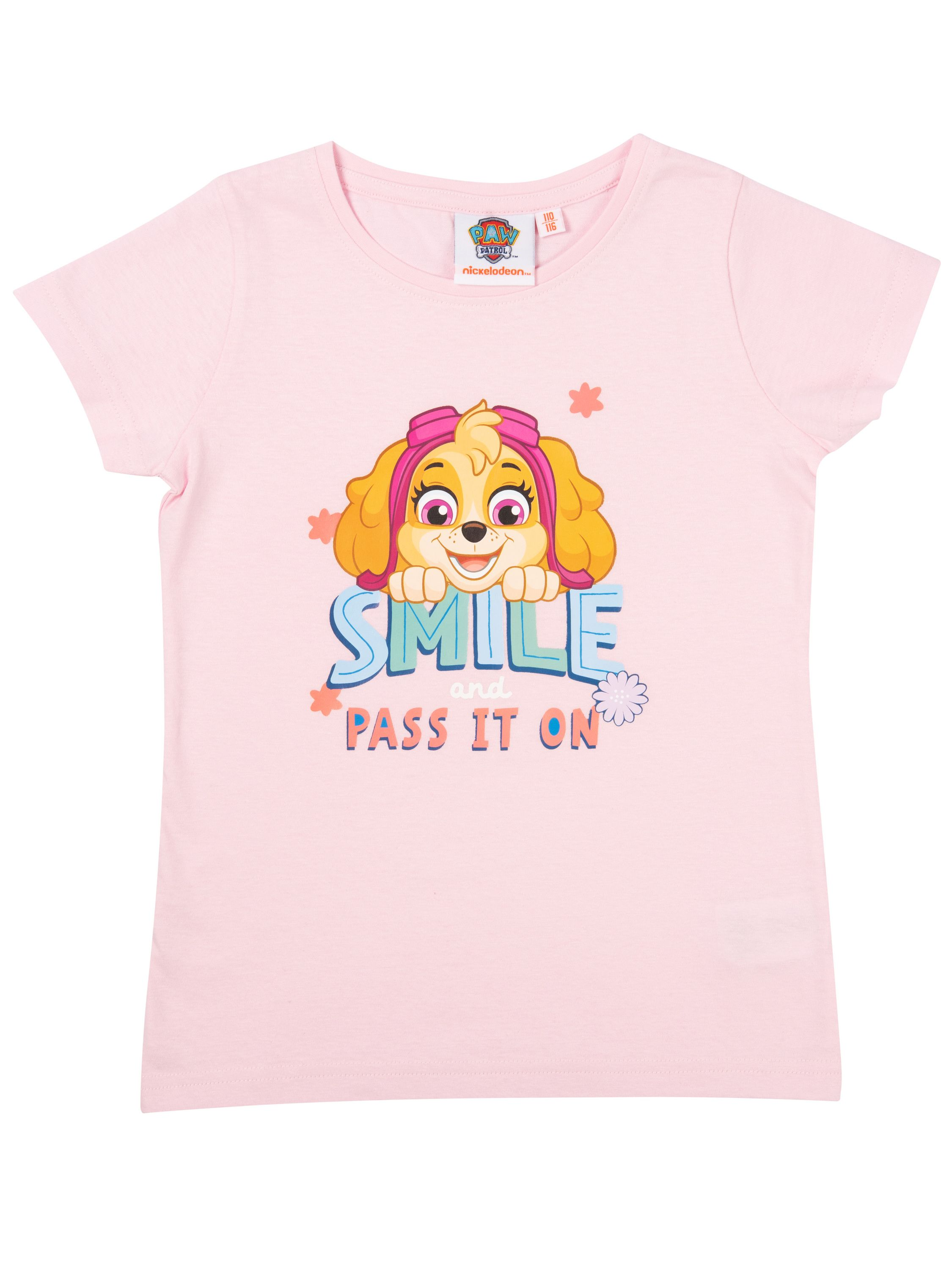 Rosa T-Shirt mit Skye von Paw Patrol. Es steht 'SMILE and PASS IT ON'. Das Shirt hat ein Nickelodeon-Etikett.