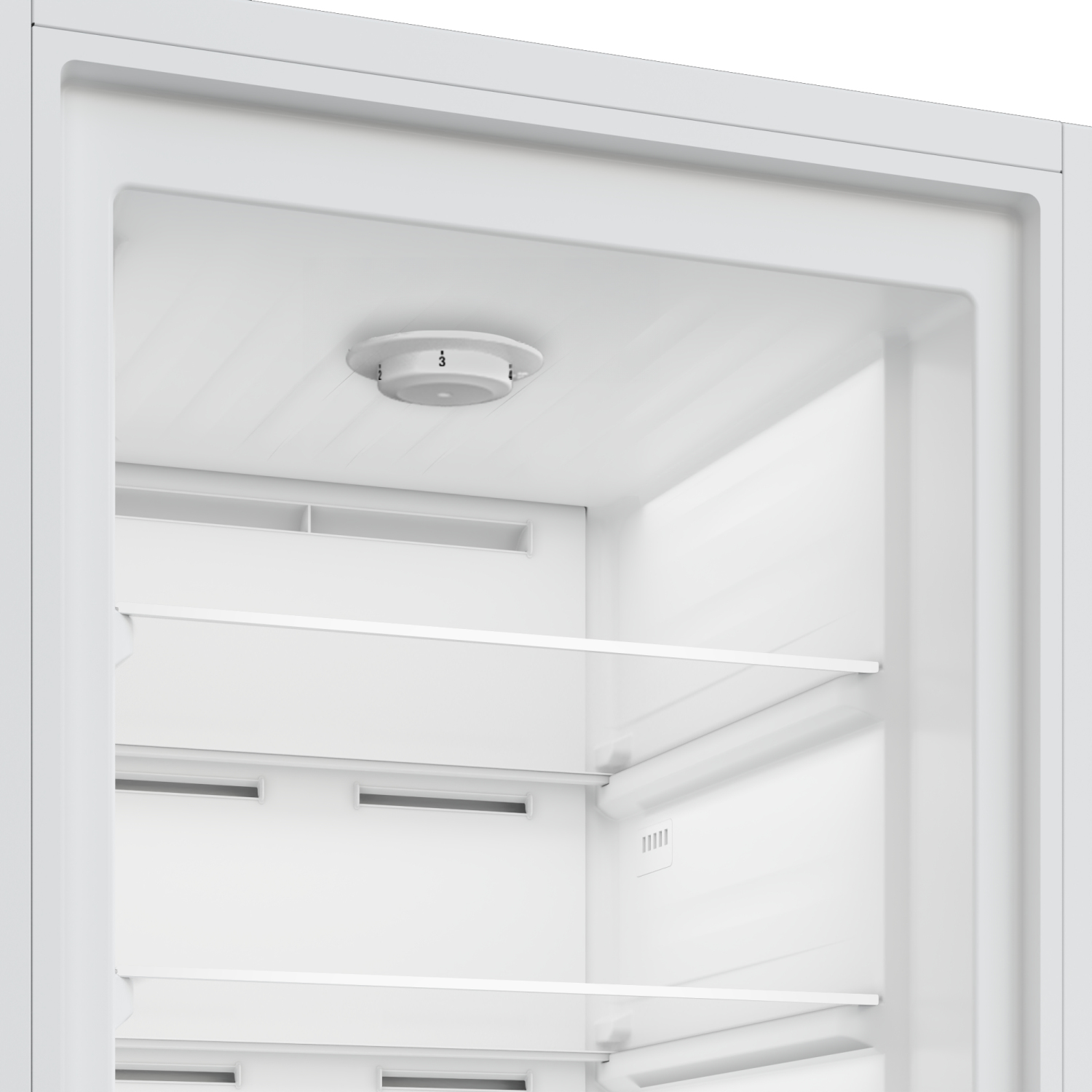 Inside of a white refrigerator. There is a temperature control dial, shelves and vents. The interior is empty.