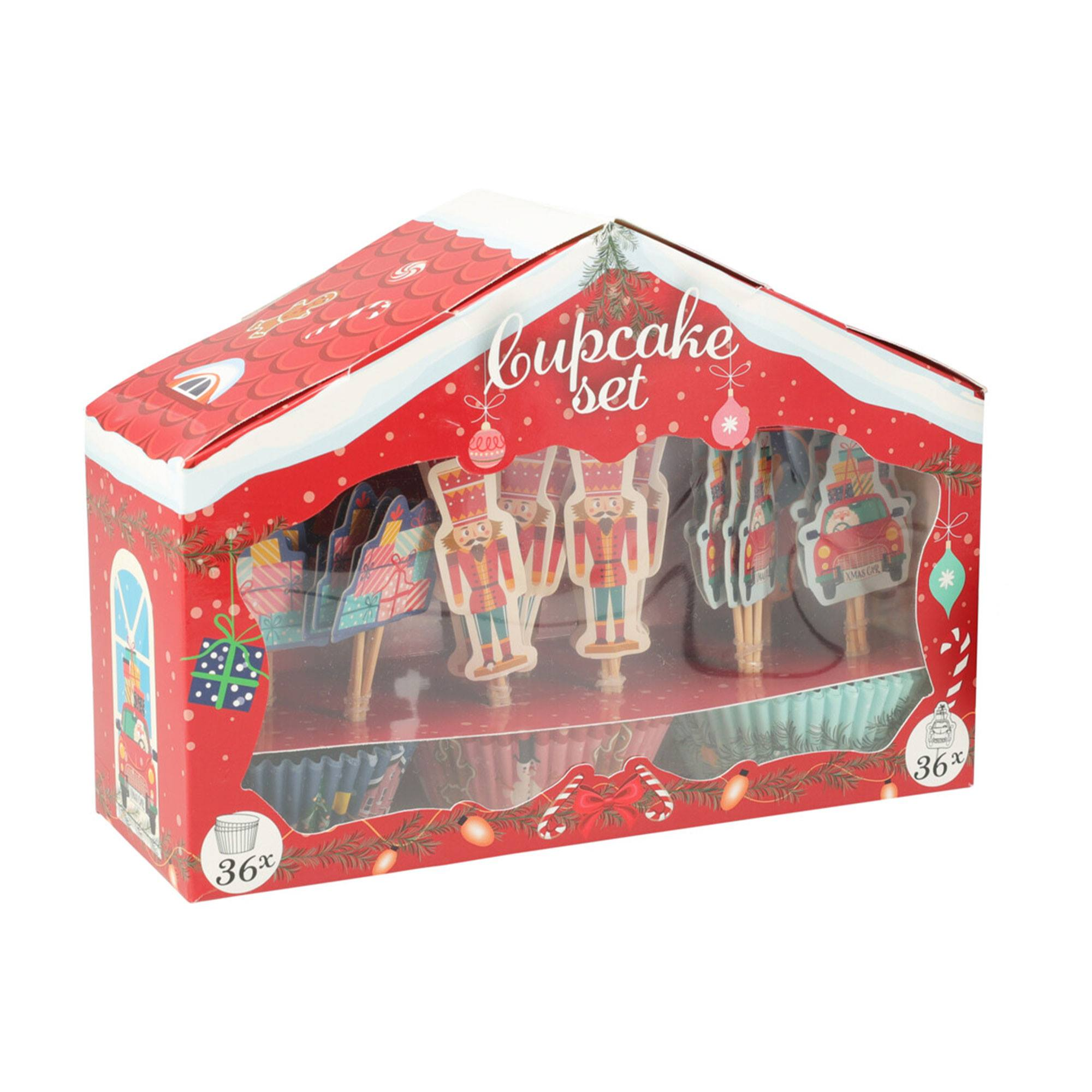 Una caja de juego de cupcakes con decoraciones navideñas. La caja tiene forma de casa. En el interior hay adornos y forros para cupcakes.