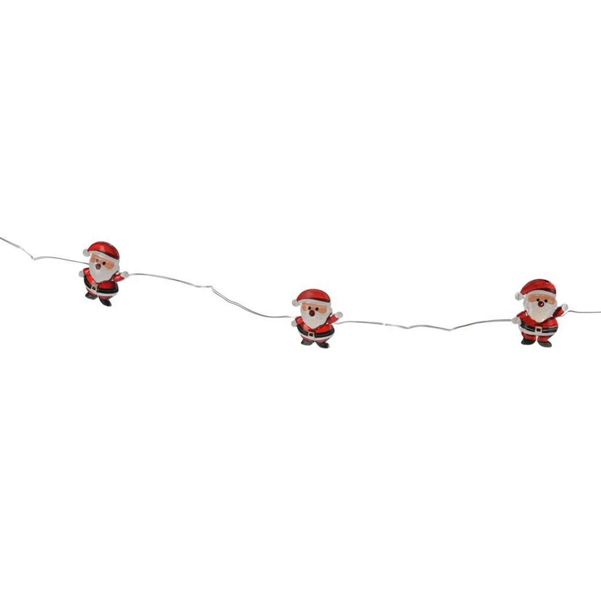 Tres adornos de Papá Noel en un alambre, sombreros y trajes rojos, barbas blancas, botas negras, aislados sobre fondo blanco.
