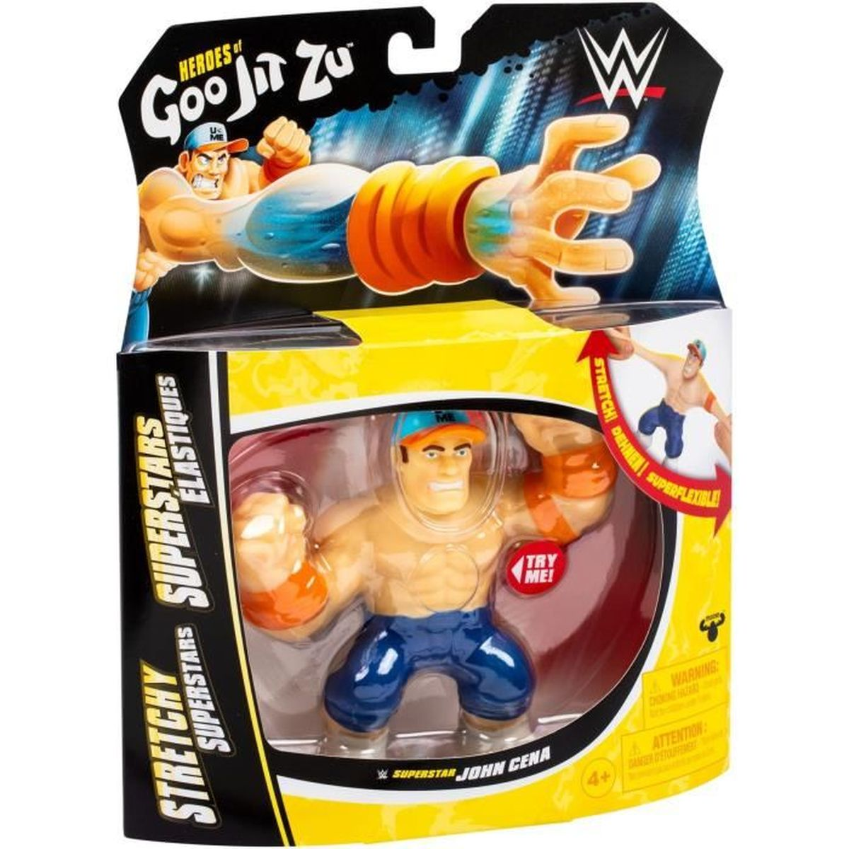 Eine John Cena Actionfigur in einer Box. Es ist ein dehnbares Spielzeug mit blauer Hose, orangefarbenen Handgelenkbändern und einer Kappe.