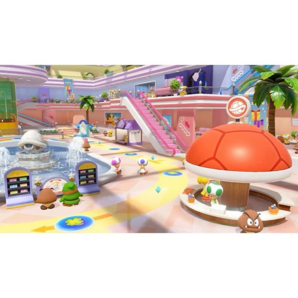 Eine farbenfrohe, cartoonartige Szene mit Charakteren aus dem Mario-Universum. Ein großer Pilz und ein Brunnen im Vordergrund.